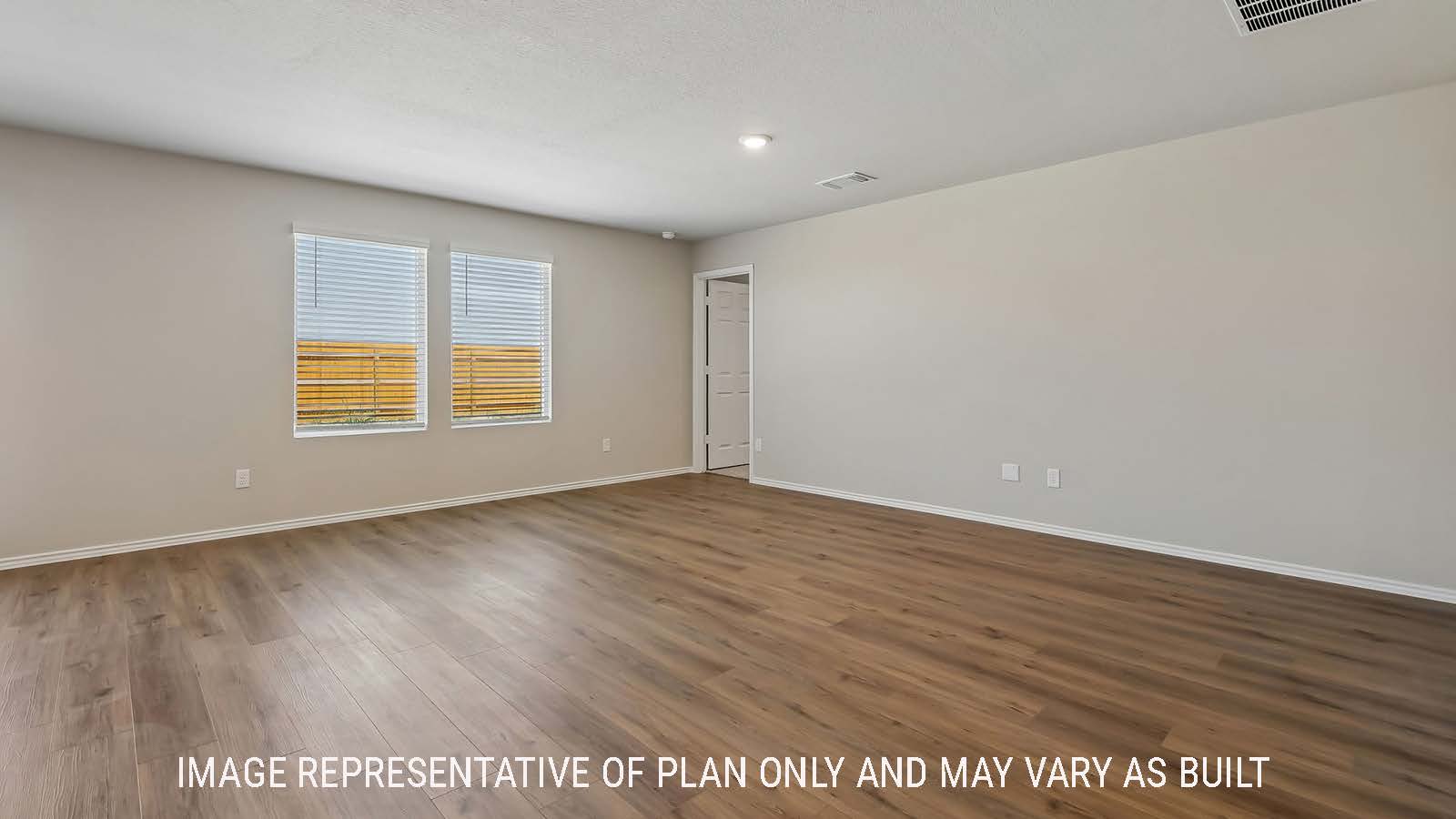 Austin living room with windows for natural lighting and view of back yard.