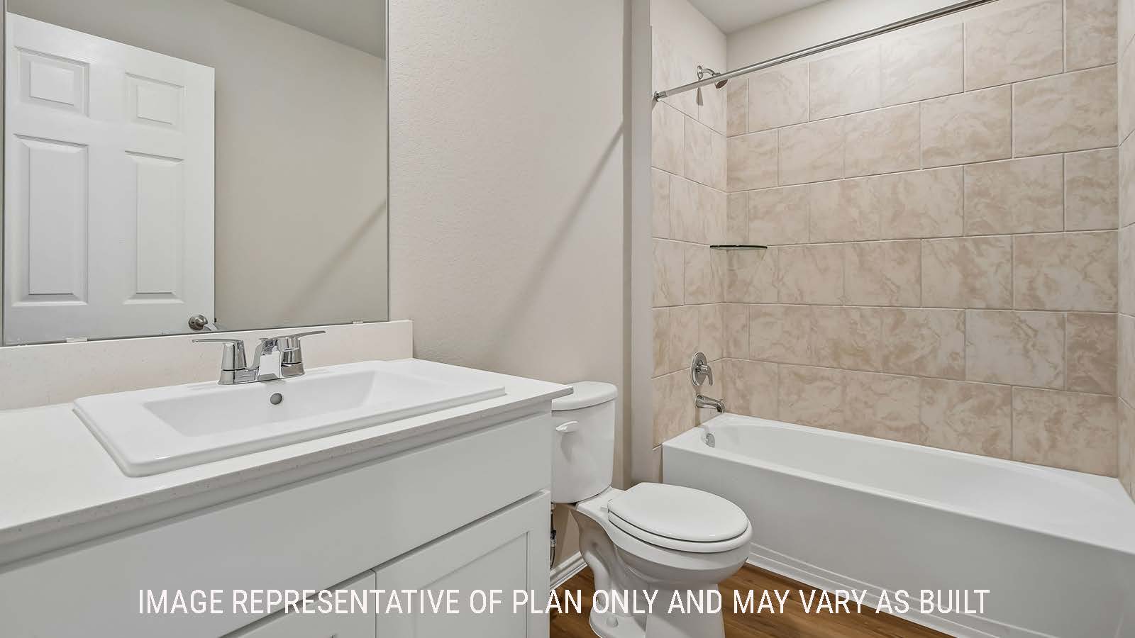 Austin secondary bathroom with vanity sink and shower and tub combo.