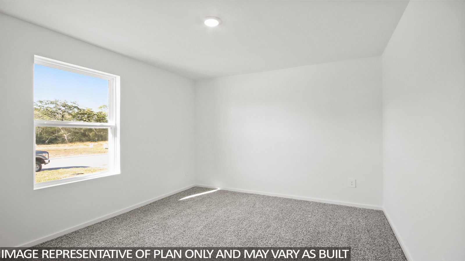 Baird secondary bedroom with carpeted flooring and window for natural lighting.