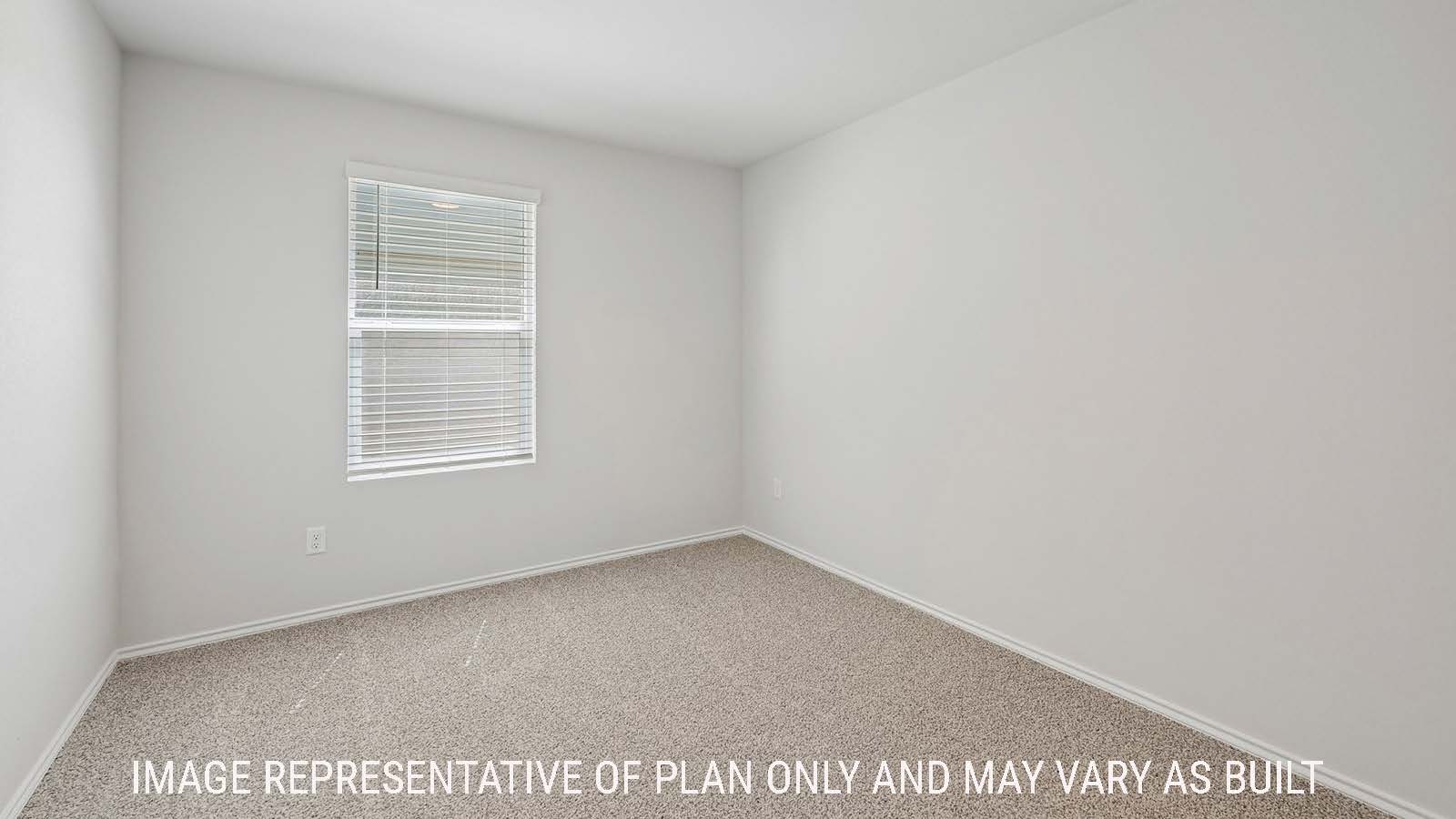 Baird secondary bedroom with carpeted flooring and window for natural lighting.