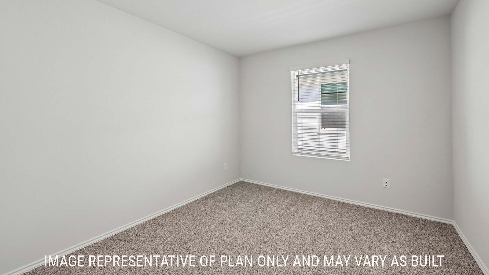 Baird secondary bedroom with carpeted flooring and window for natural lighting.