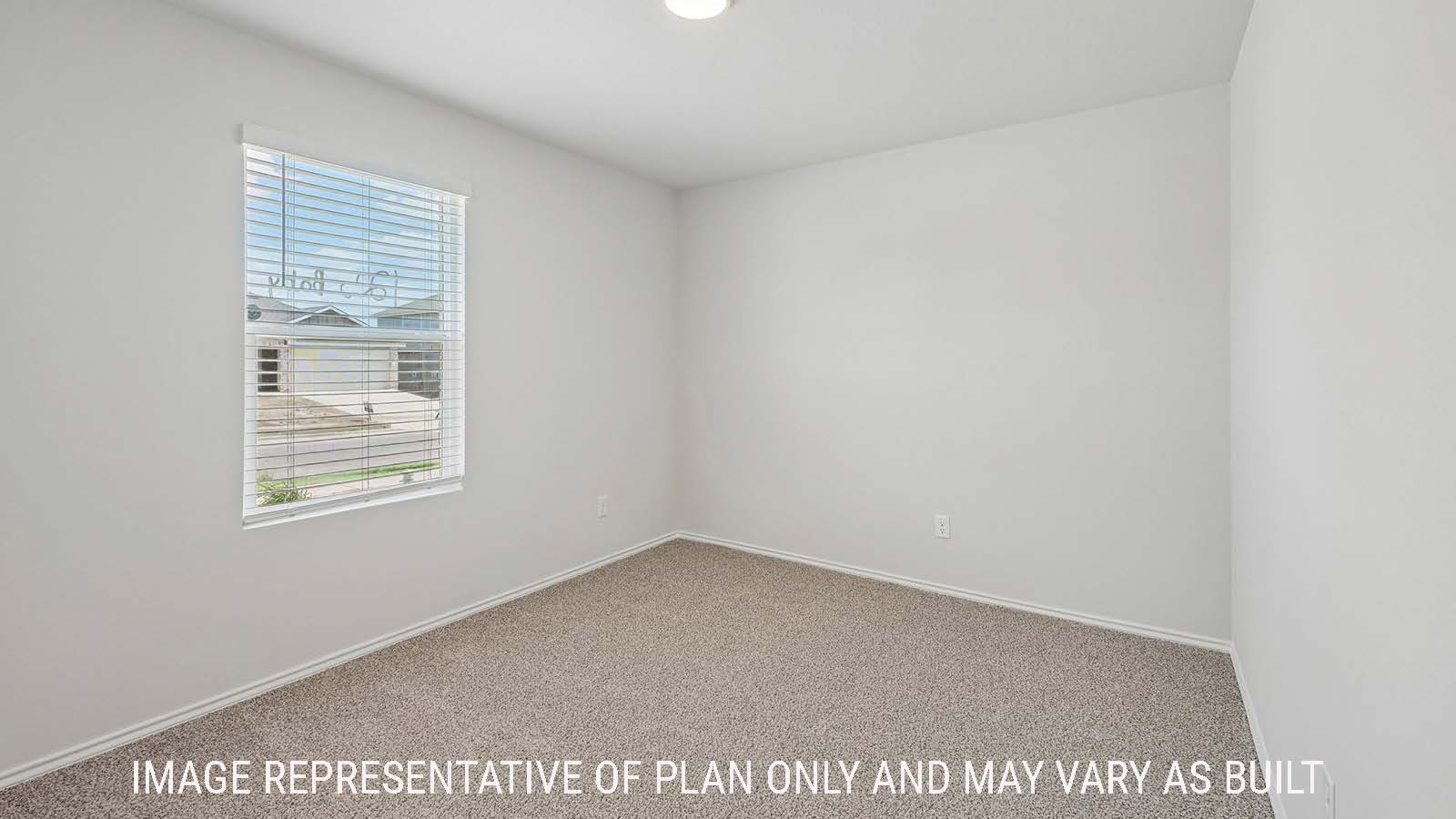 Baird secondary bedroom with carpeted flooring and window for natural lighting.