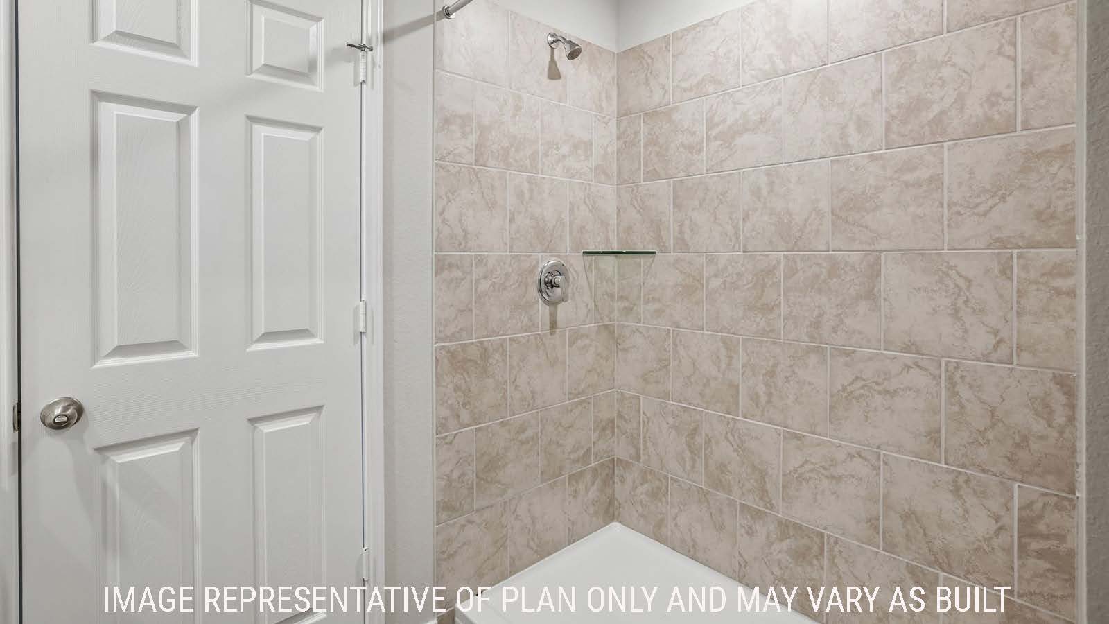 Cooper primary bathroom with view of walk-in shower and of primary bedroom walk-in closet.