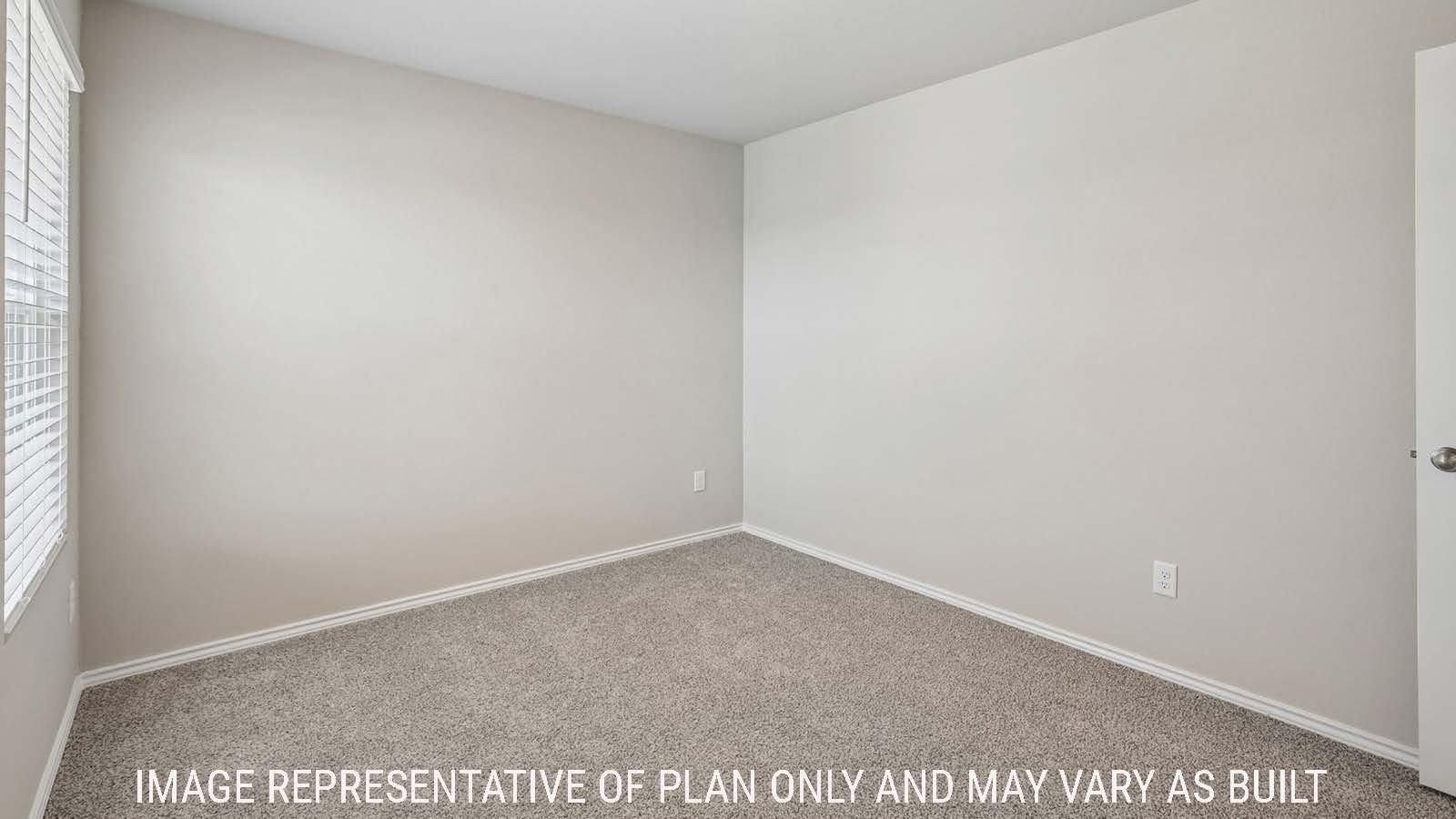 Cooper secondary bedroom with carpeted flooring and window for natural lighting.