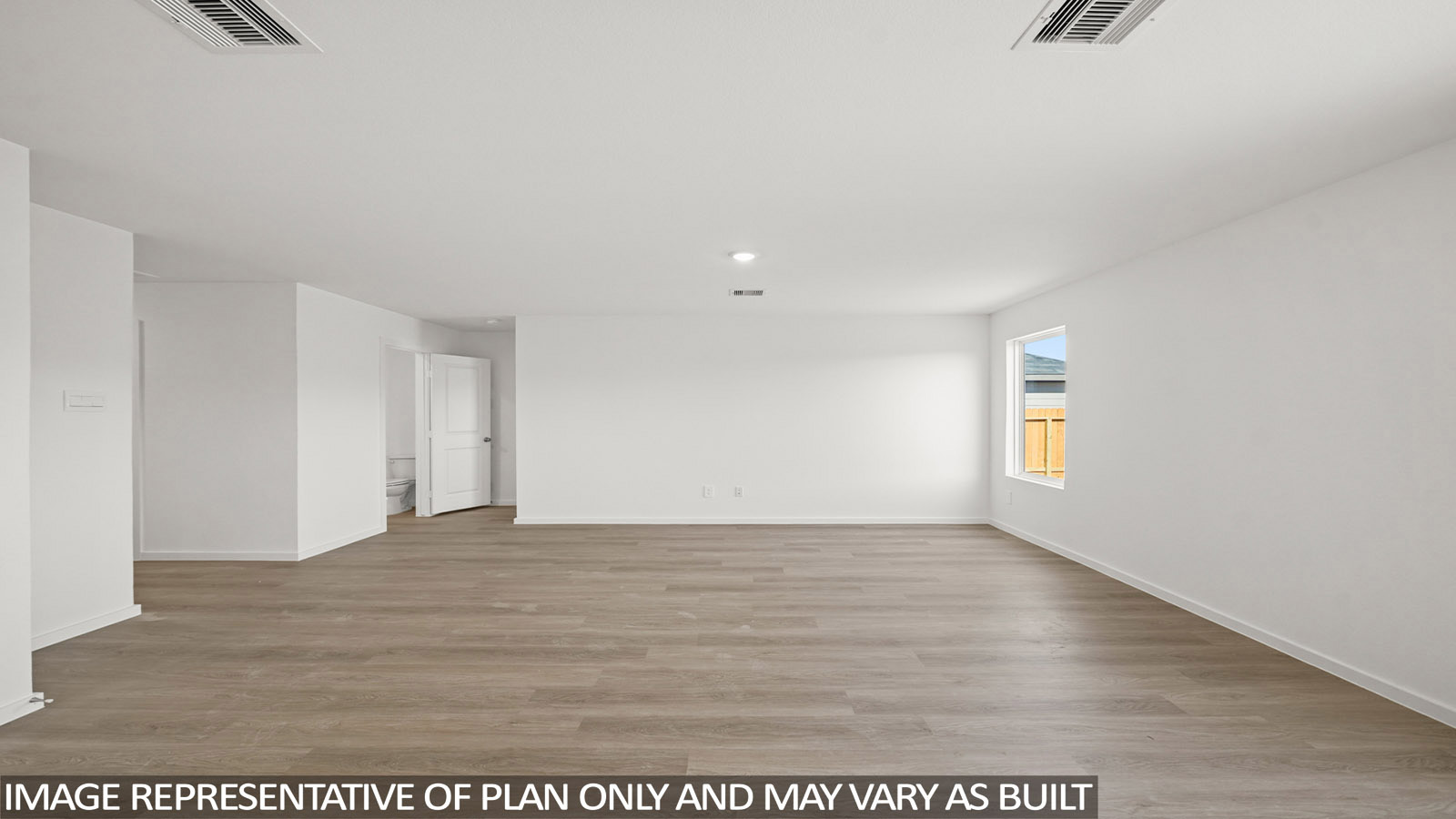 Cooper living room with vinyl plank flooring and window for natural lighting.