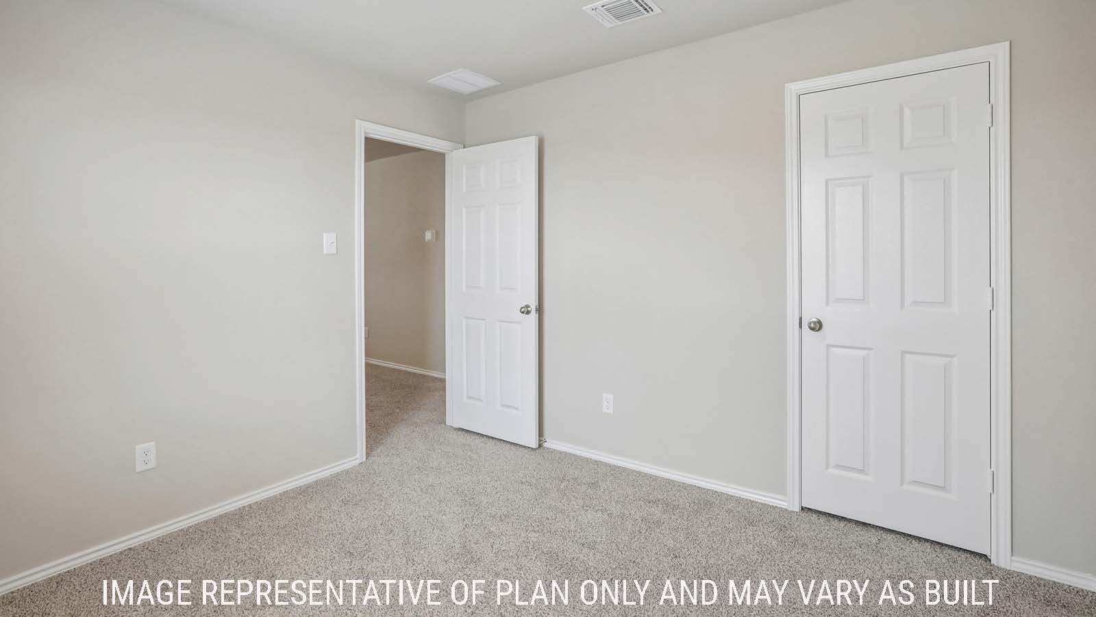 Cooper secondary bedroom with carpeted flooring and view of hallway and game room.