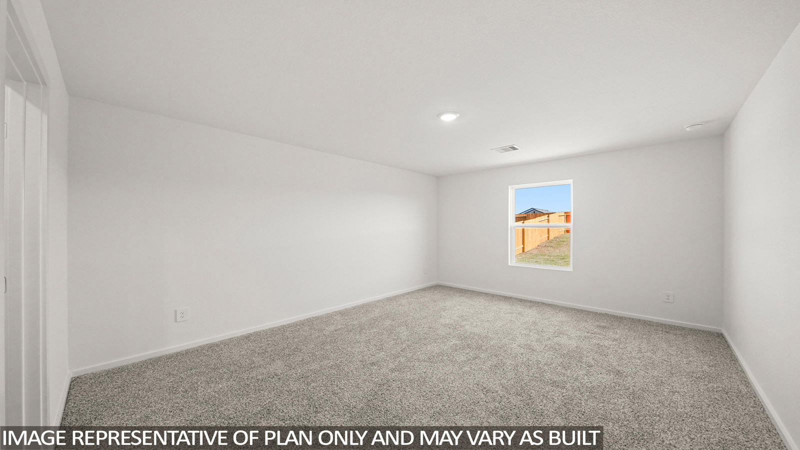 Cooper primary bedroom with carpeted flooring and window for natural lighting.