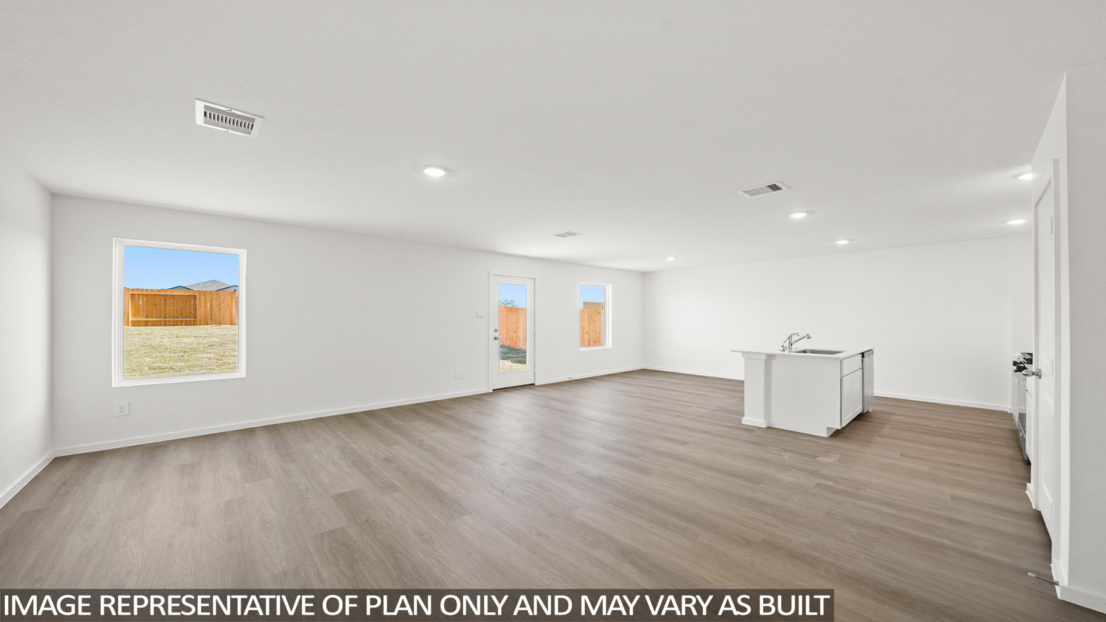 Cooper living room with vinyl plank flooring and view of open-concept dining room and kitchen.