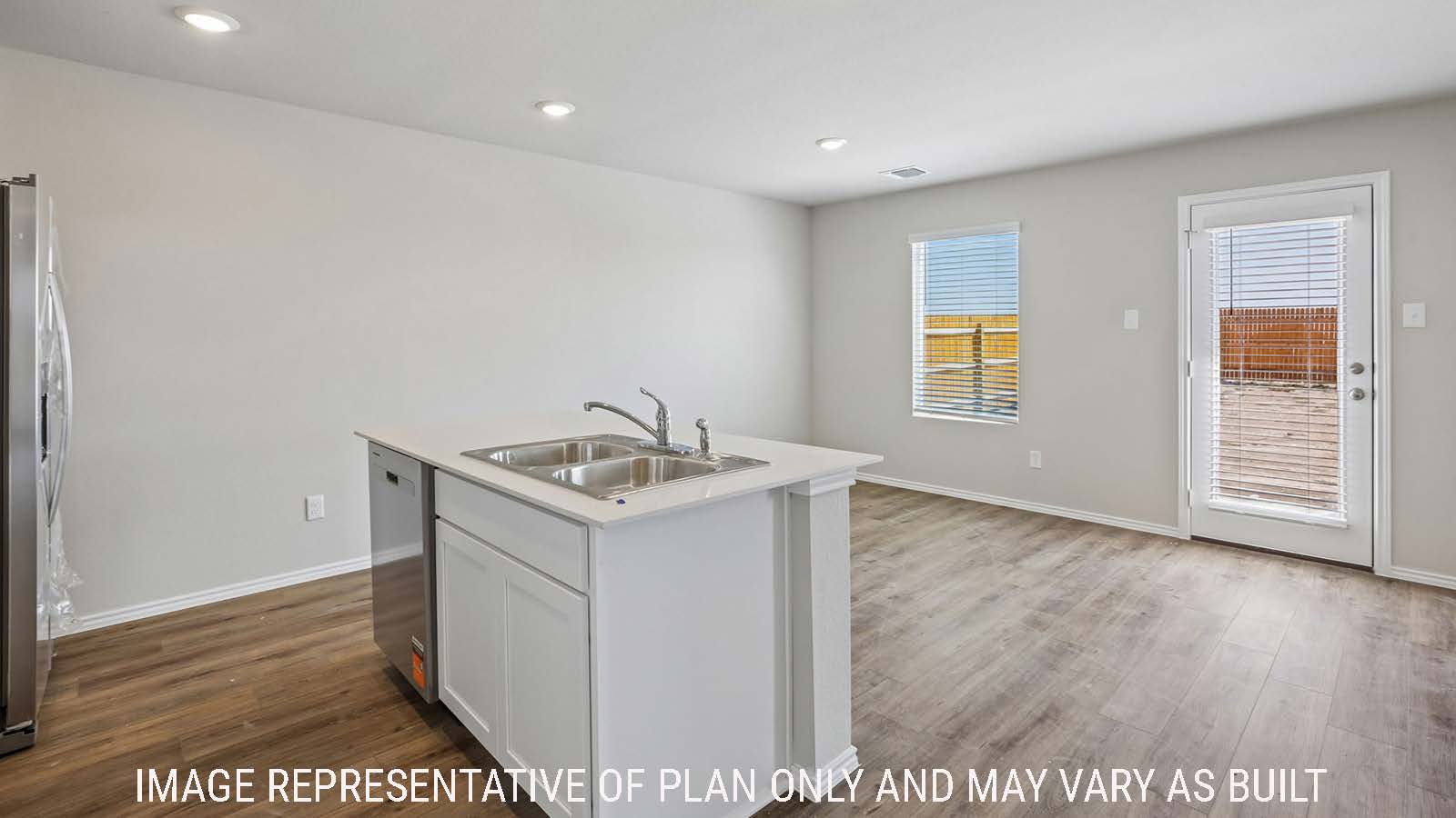 Cooper kitchen with kitchen island with view of open concept dining room and windows for natural lighting.