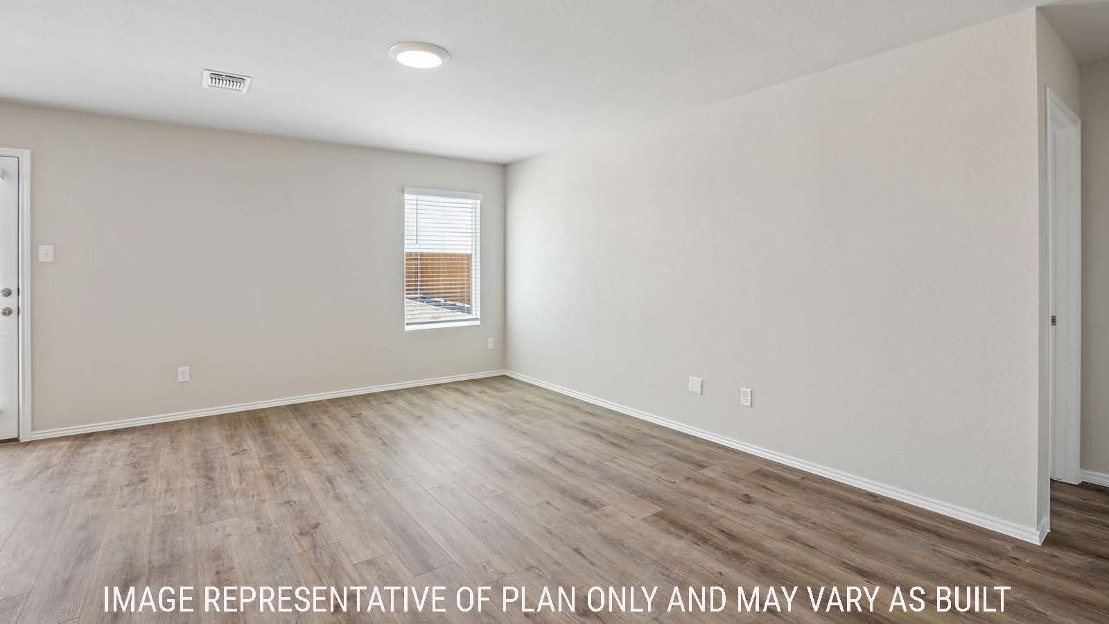Cooper living room with window for natural lighting and view of primary bedroom.