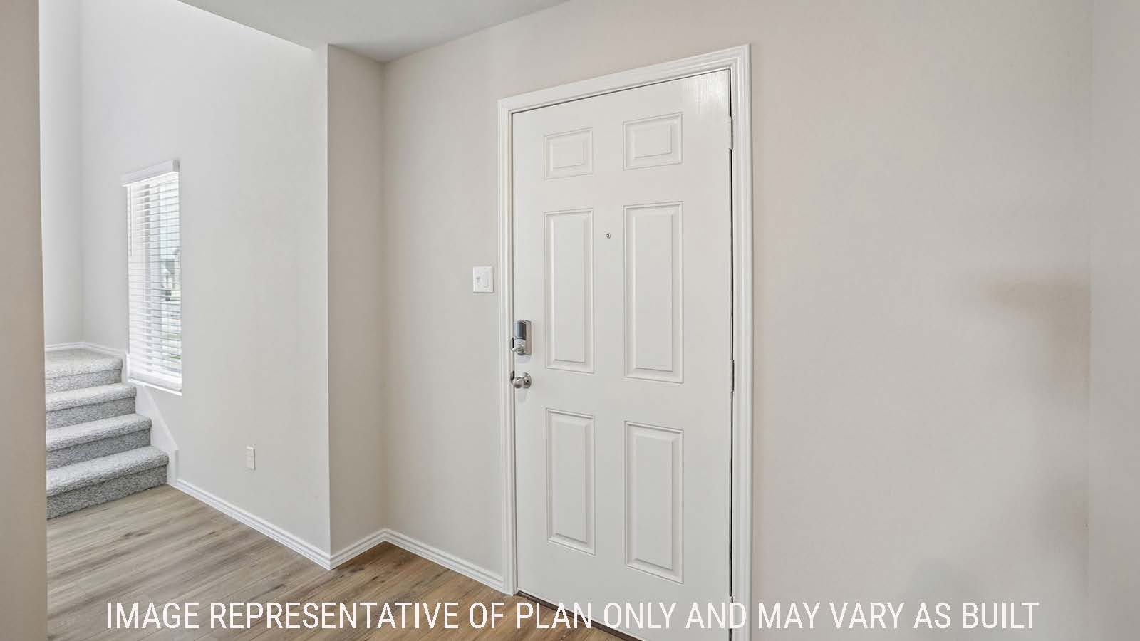 Cooper entry hallway with view of front door and stairs to the second floor.