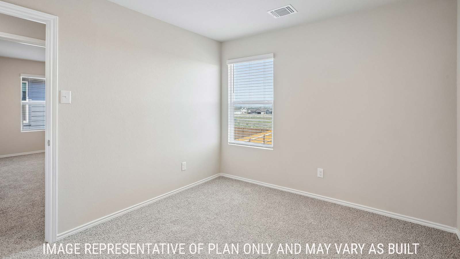 Cooper secondary bedroom with carpeted flooring and window for natural lighting.