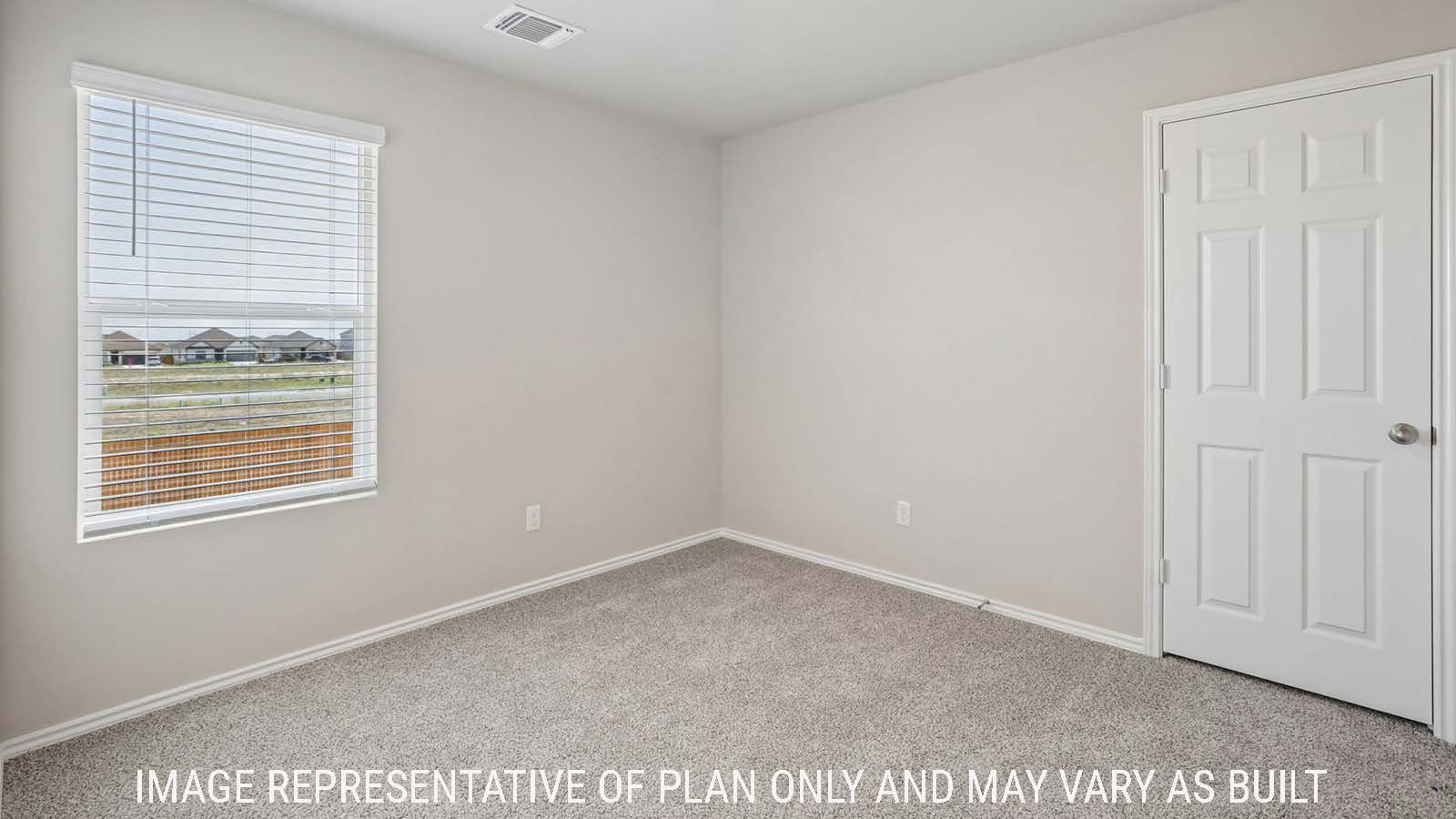 Cooper secondary bedroom with carpeted flooring and window for natural lighting.