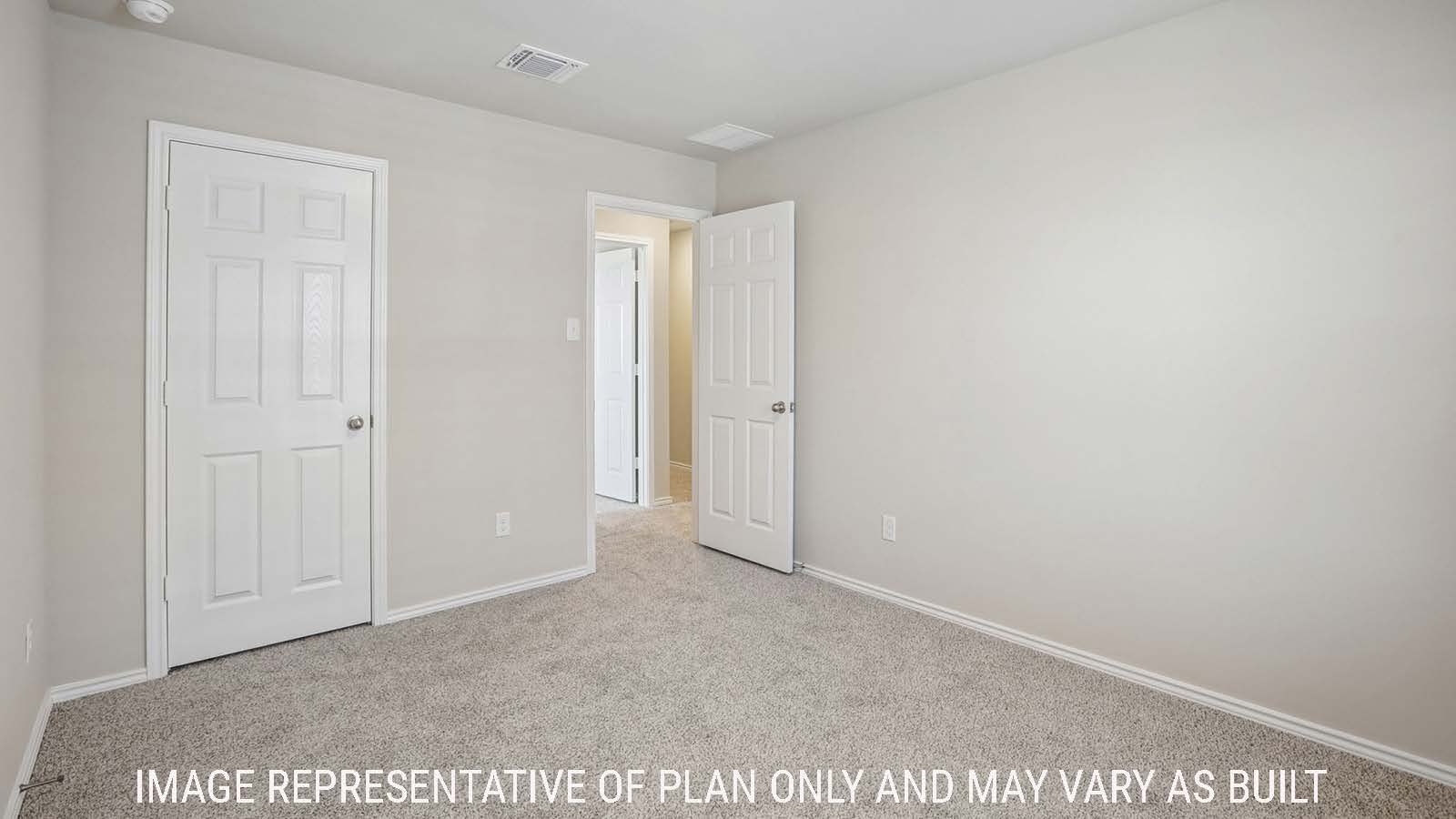 Cooper secondary bedroom with carpeted flooring and view of hallway and game room.