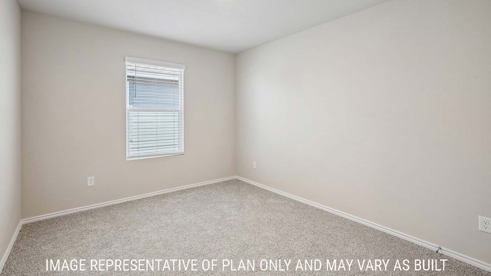 Cooper secondary bedroom with carpeted flooring and window for natural lighting.