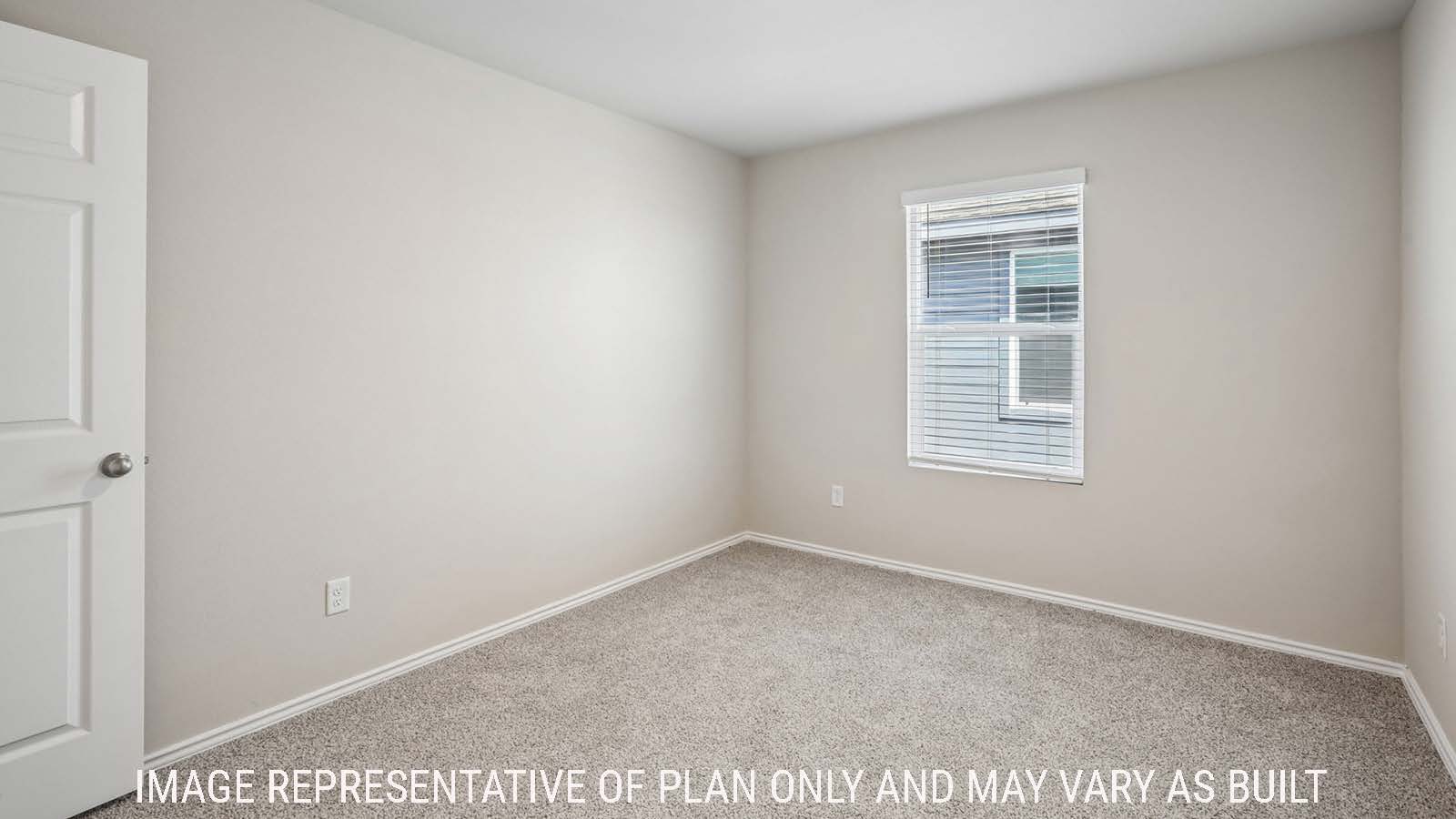 Cooper secondary bedroom with carpeted flooring and window for natural lighting.