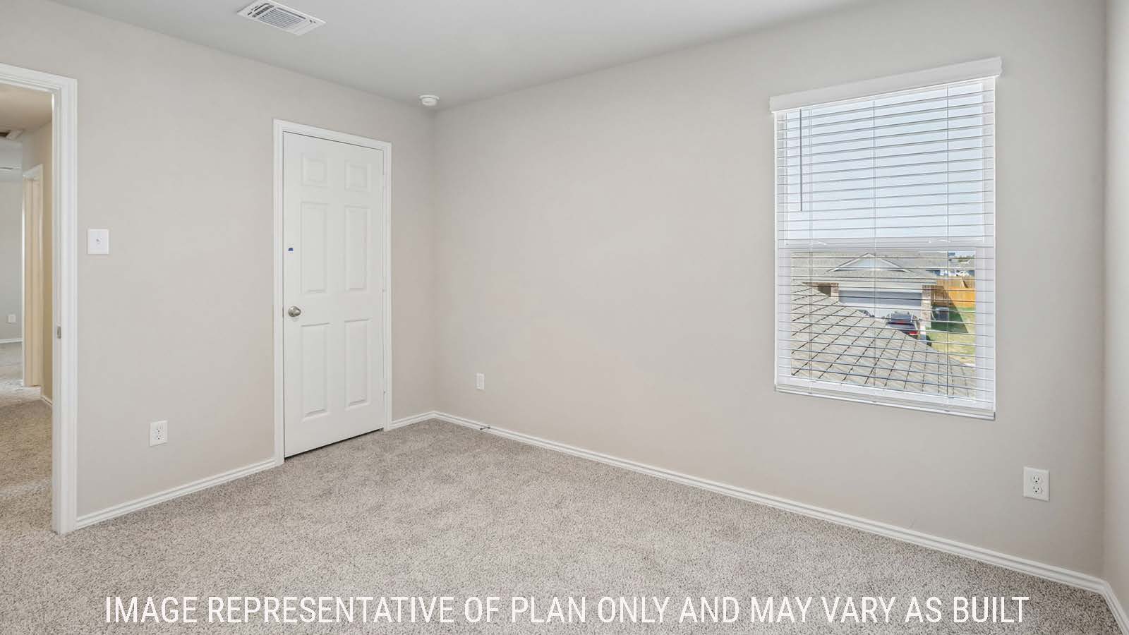 Cooper secondary bedroom with carpeted flooring and window for natural lighting.