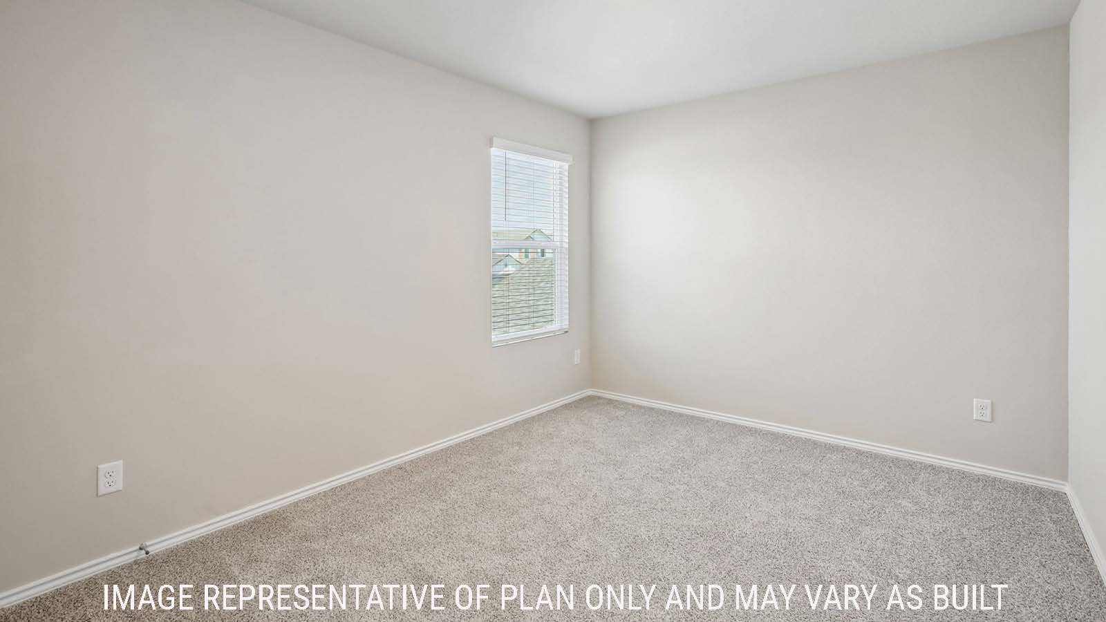 Cooper secondary bedroom with carpeted flooring and window for natural lighting.