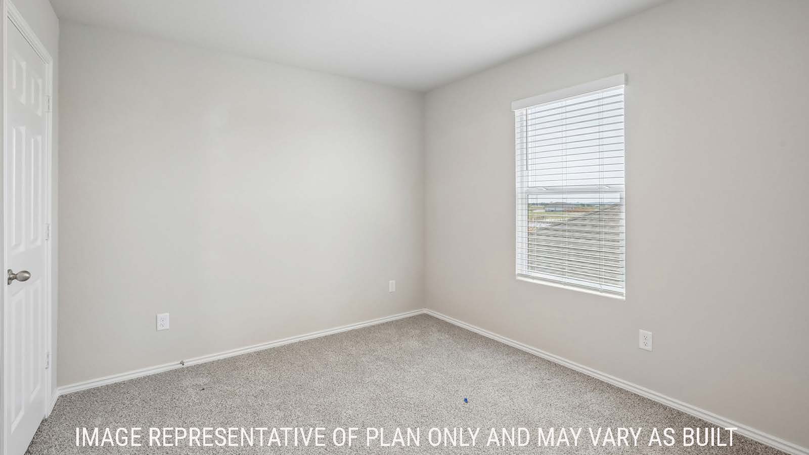 Cooper secondary bedroom with carpeted flooring and window for natural lighting.