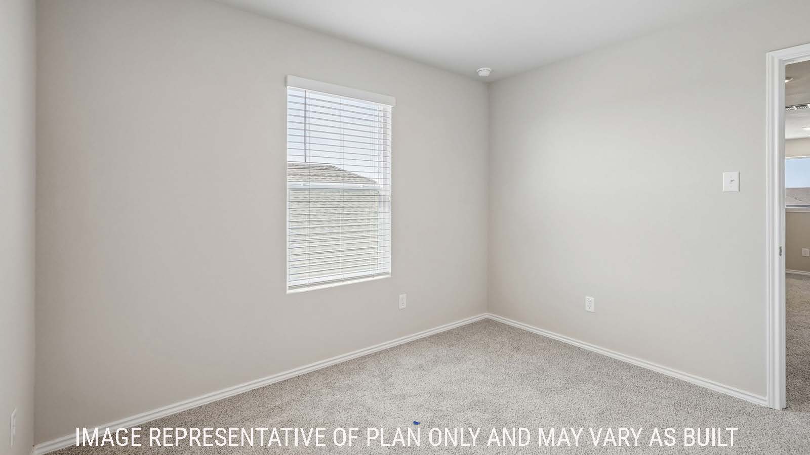 Cooper secondary bedroom with carpeted flooring and window for natural lighting.