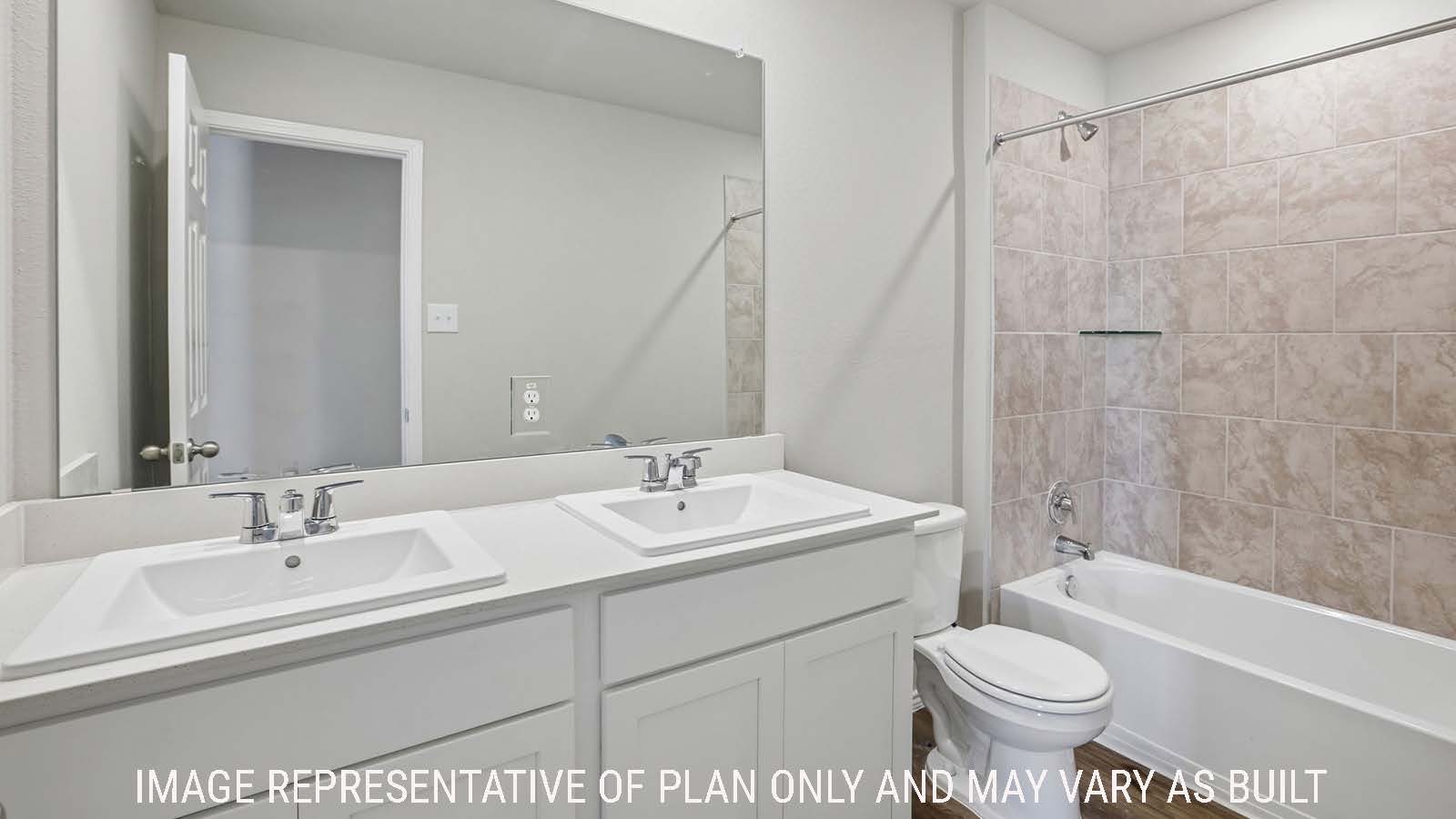 Cooper secondary bathroom with double vanity sink and shower and tub combo.