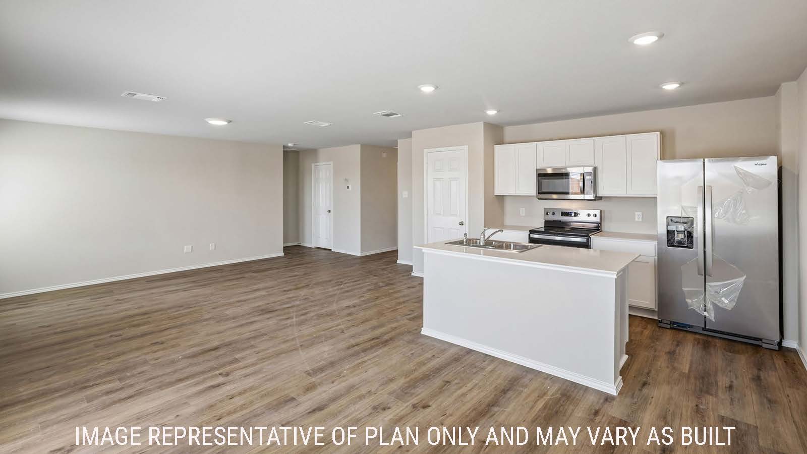 Cooper dining room with view of open concept kitchen and living room.