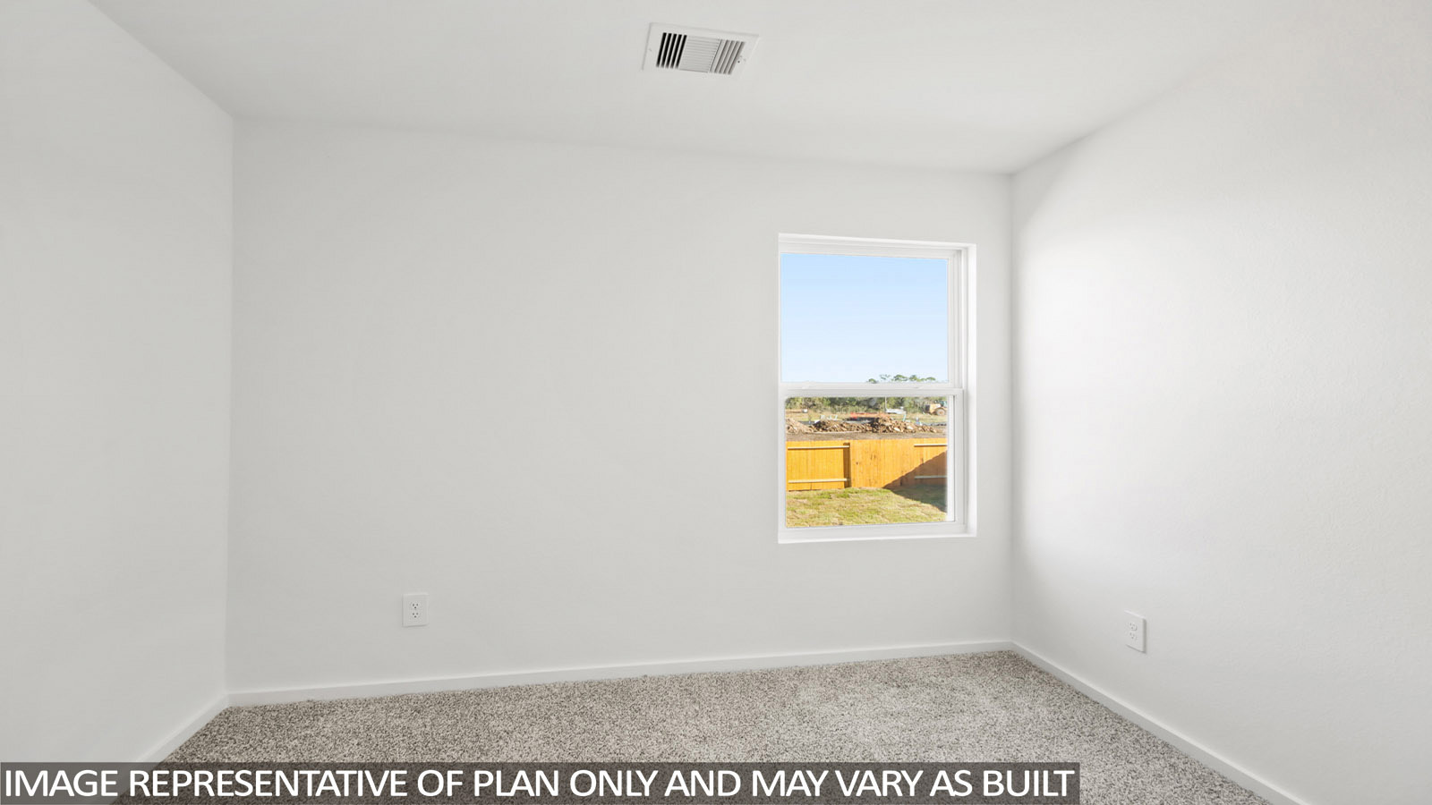 Denise secondary bedroom with carpeted flooring and window for natural lighting.
