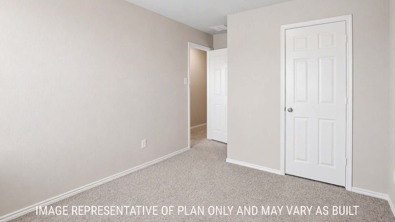 Denise secondary bedroom with carpeted flooring view of hallway to game room.