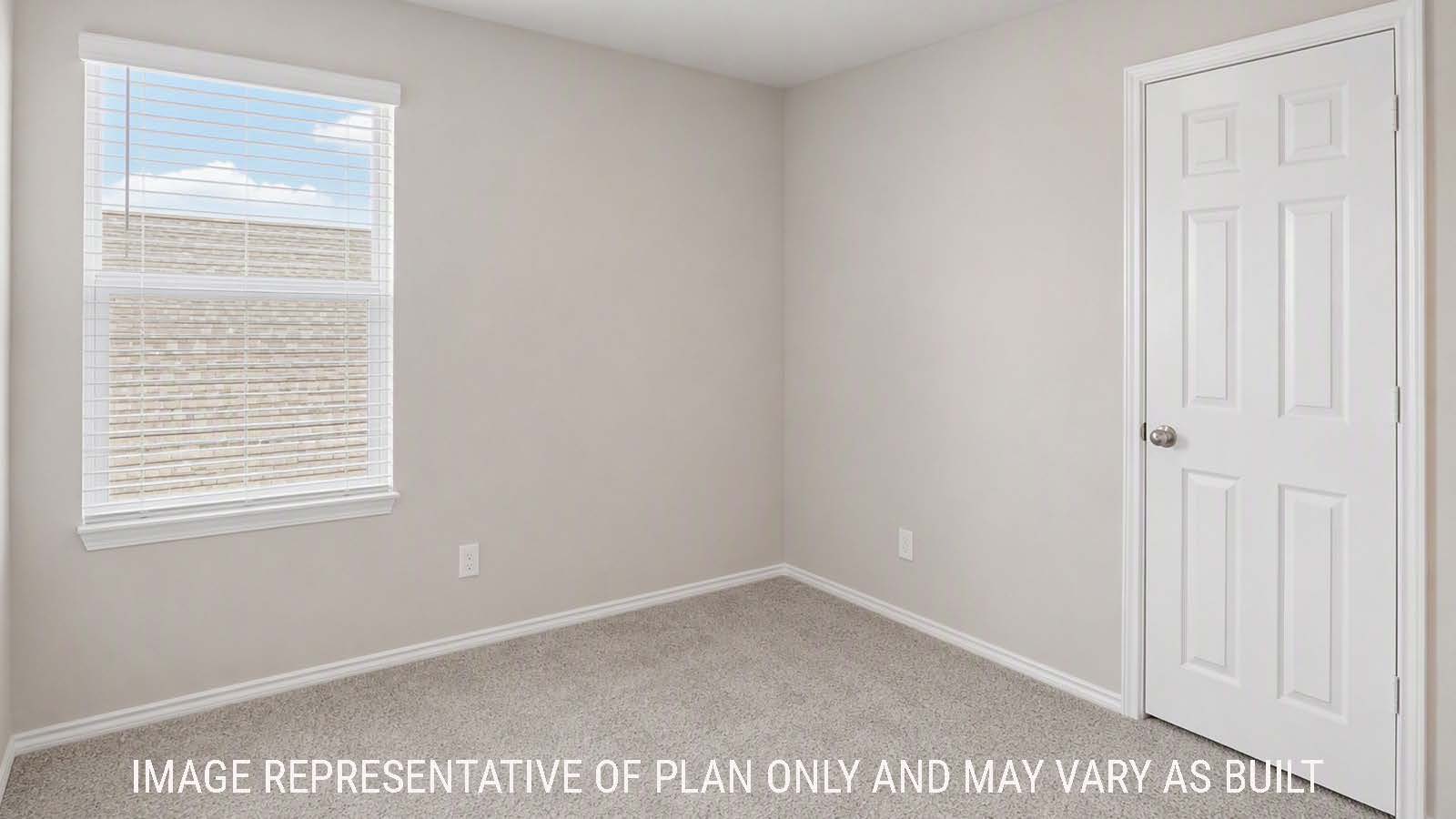 Denise secondary bedroom with carpeted flooring and windows for natural lighting.