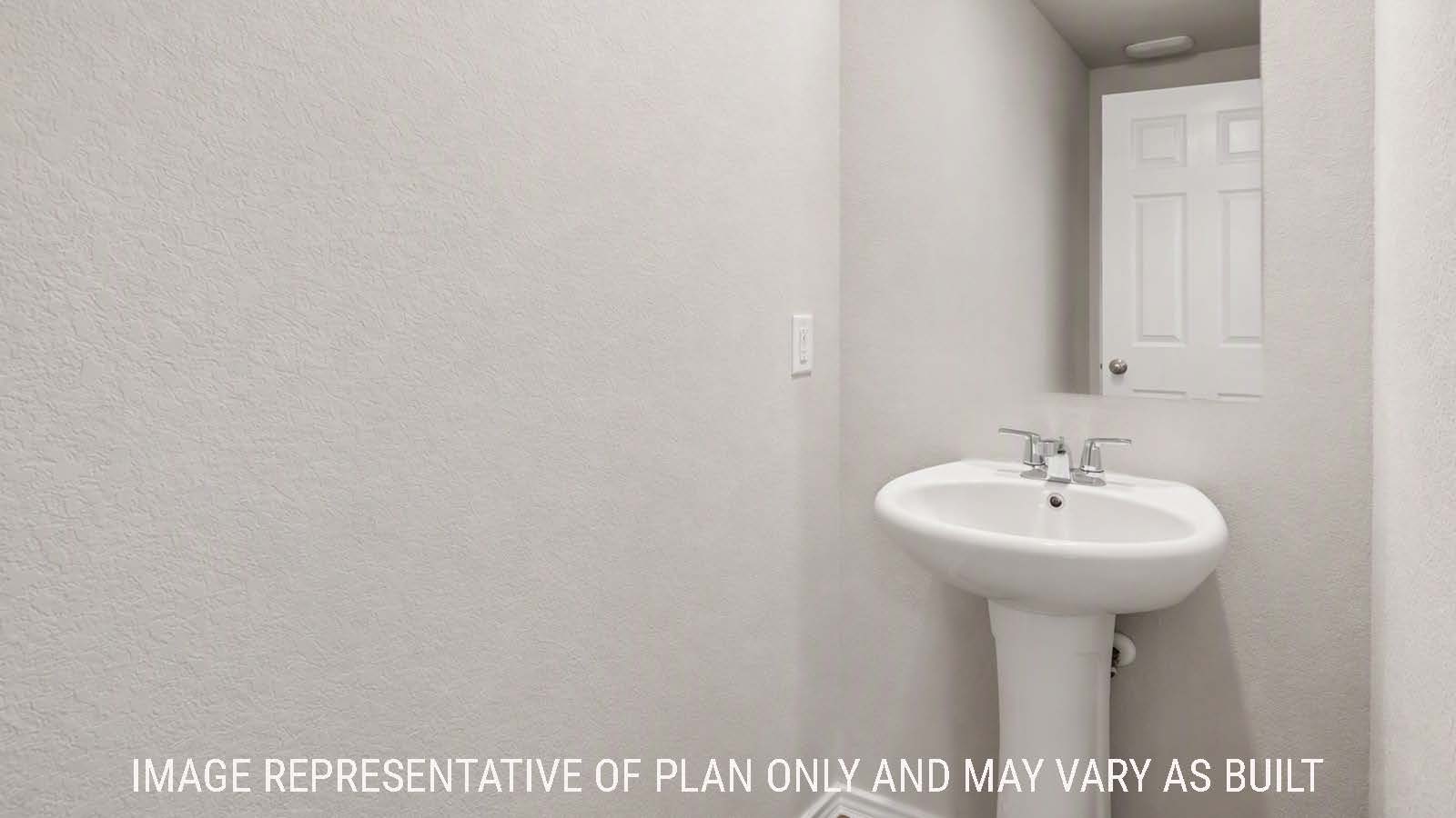 Denise half bath with sink and mirror.