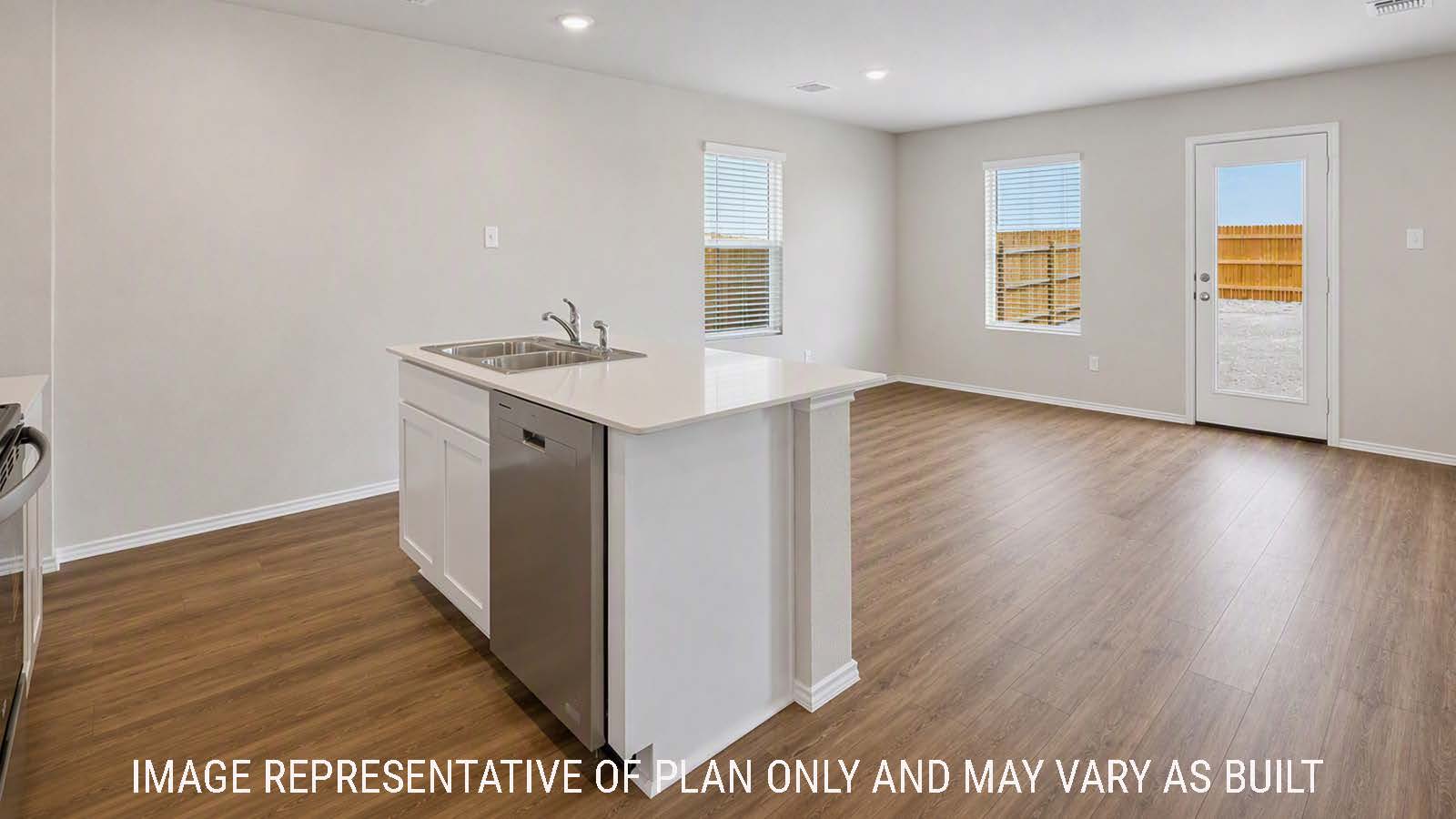 Denise kitchen with kitchen island with view of open concept dining room and living room.