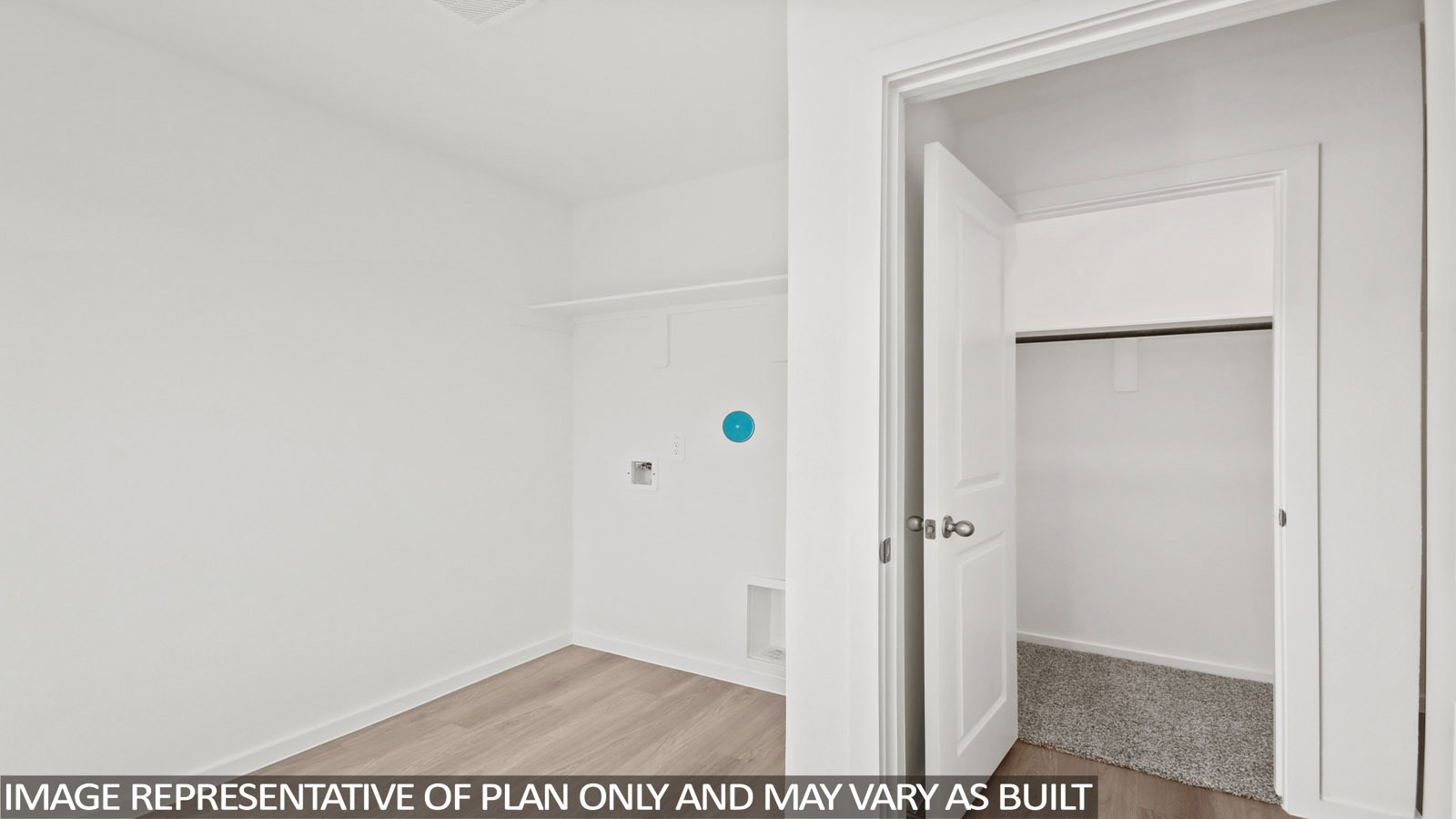 Denise utility room with washer and dryer connections and shelving for storage.