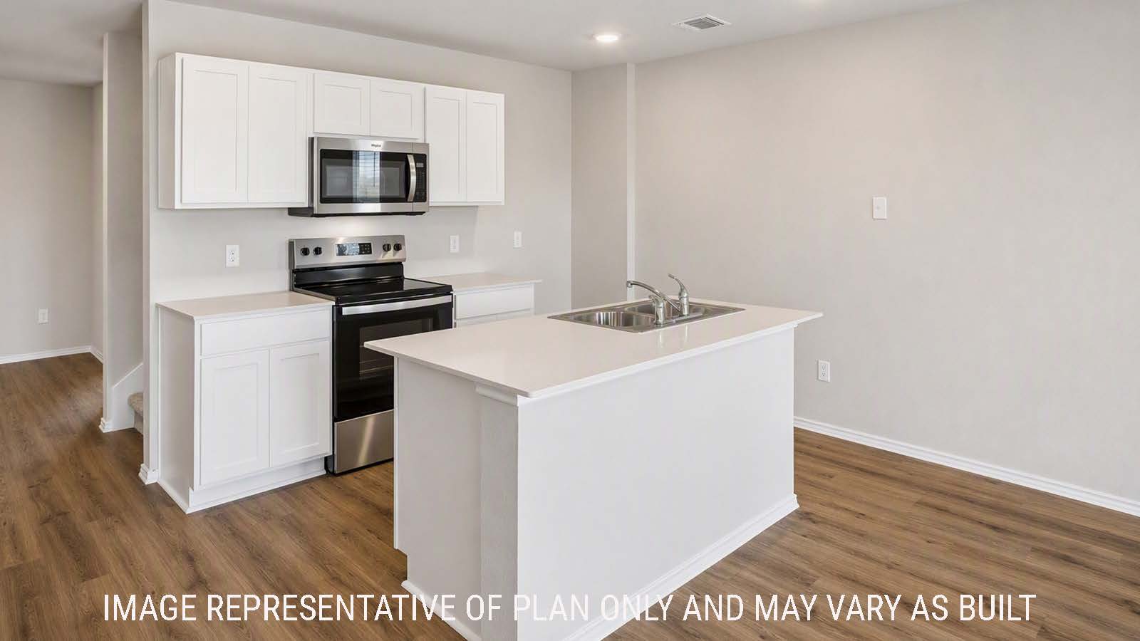 Denise kitchen with kitchen island with white cabinets and view of front entry hallway.