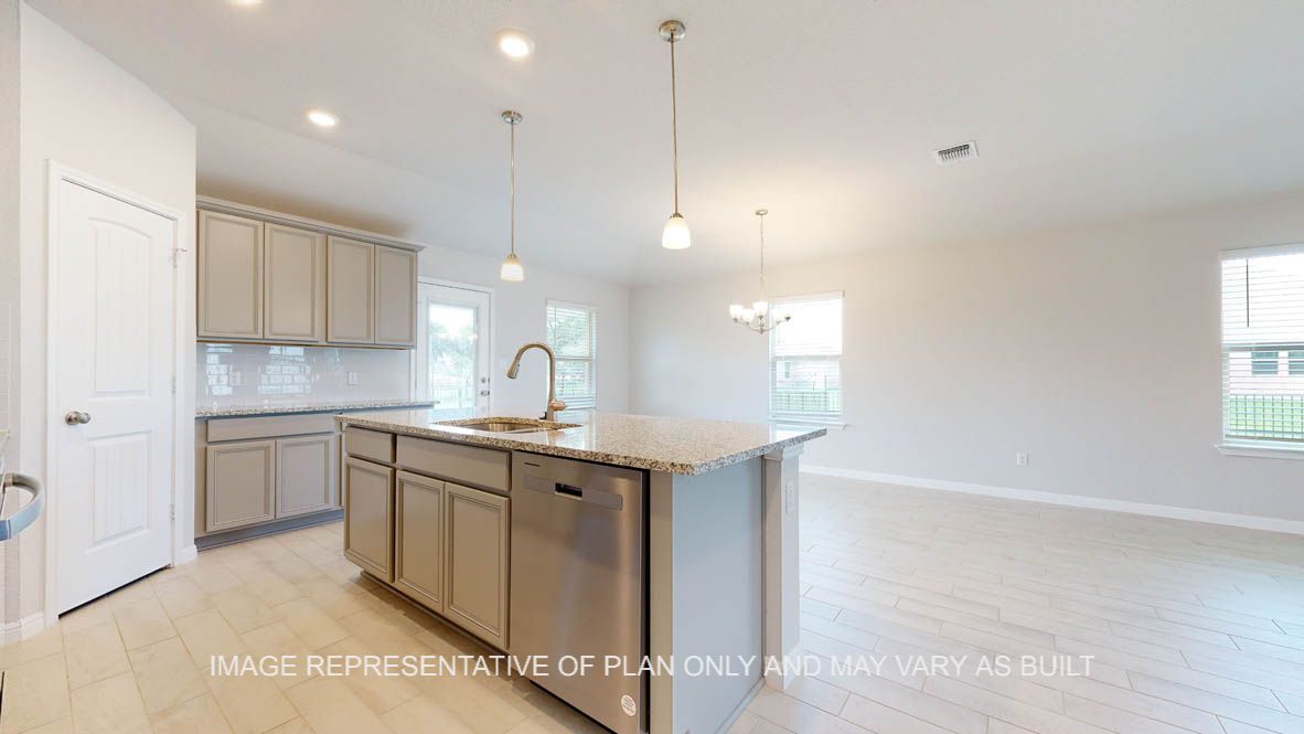 Elmwood kitchen with larger center island and undermount sink.