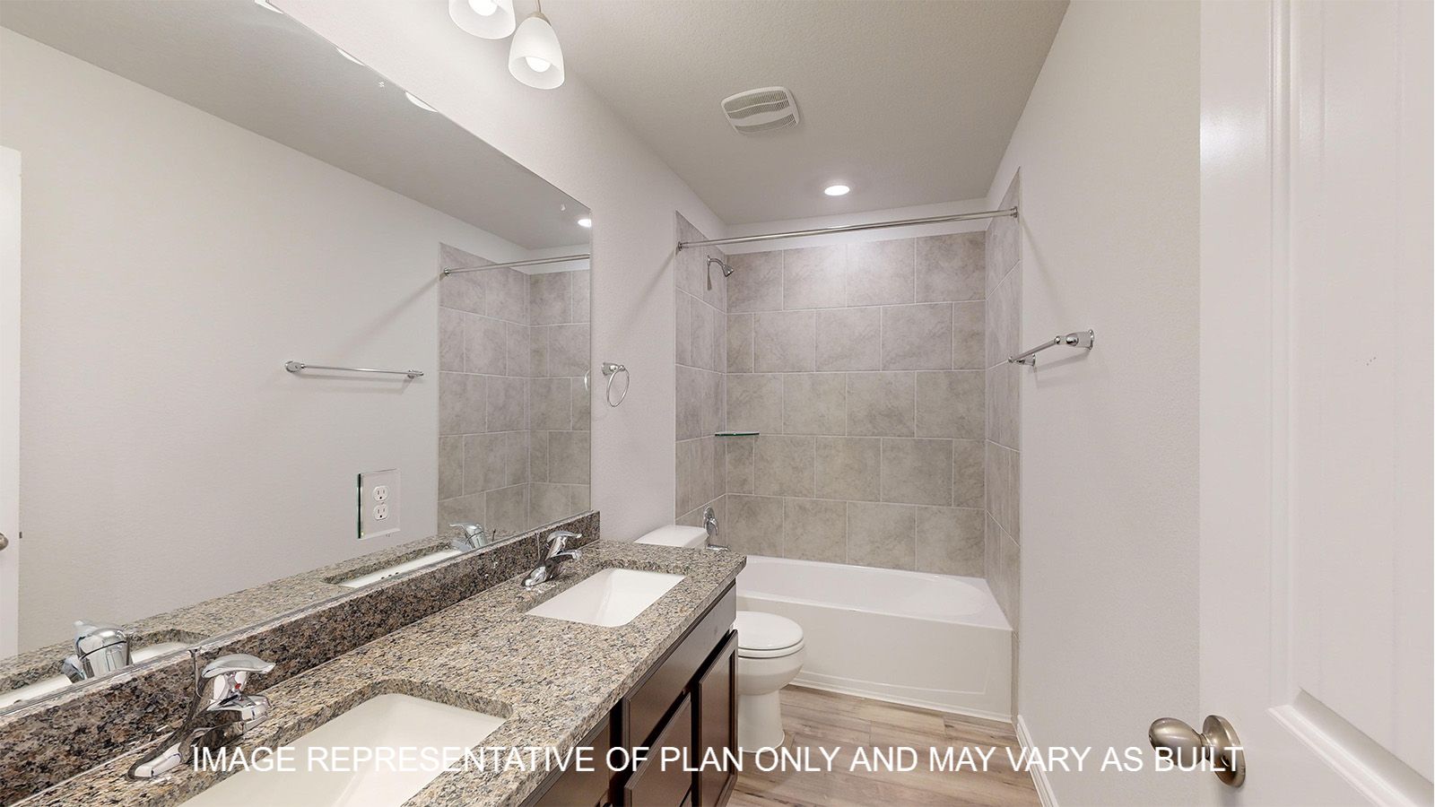 Magnolia secondary bathroom with dual vanities and granite countertops.