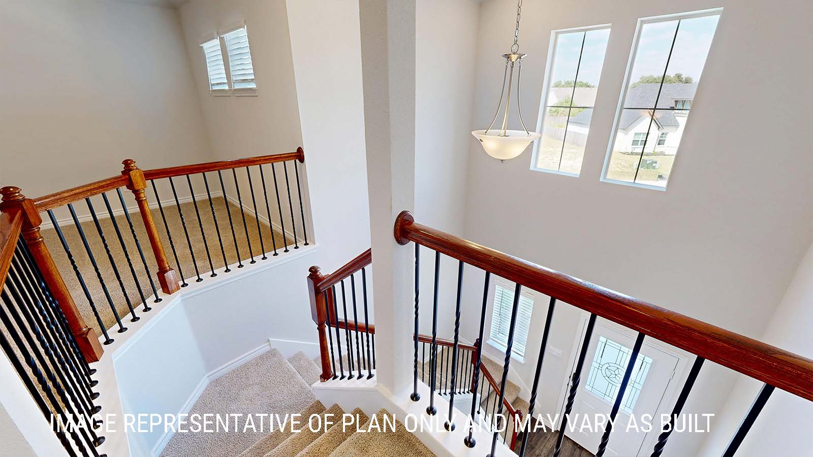Sonoma stairs with view of entry way and front door.