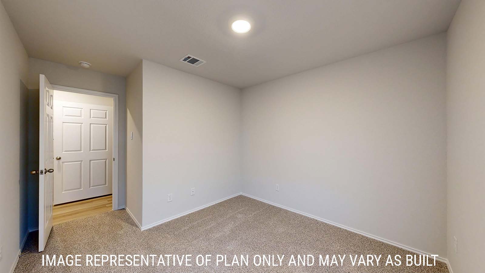 Harris secondary bedroom with carpeted flooring and view of hallway.