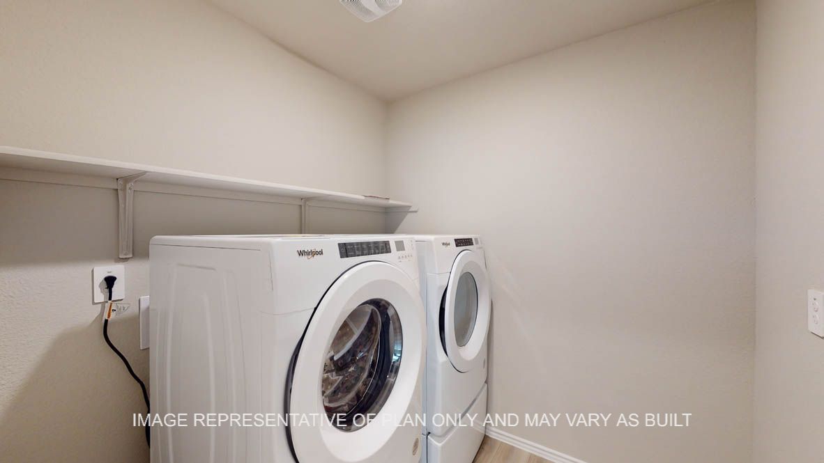 Texas Cali utility room with washer and dryer with storage shelf.
