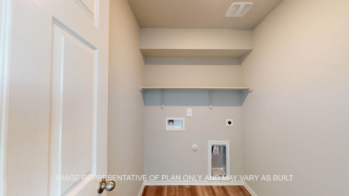 Kingston utility room with washer and dryer connections with storage shelf.
