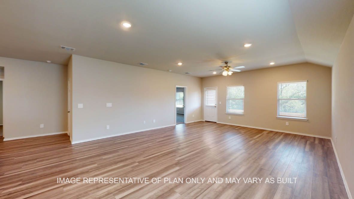 Kingston open concept dining room and living room with vinyl plank flooring throughout.