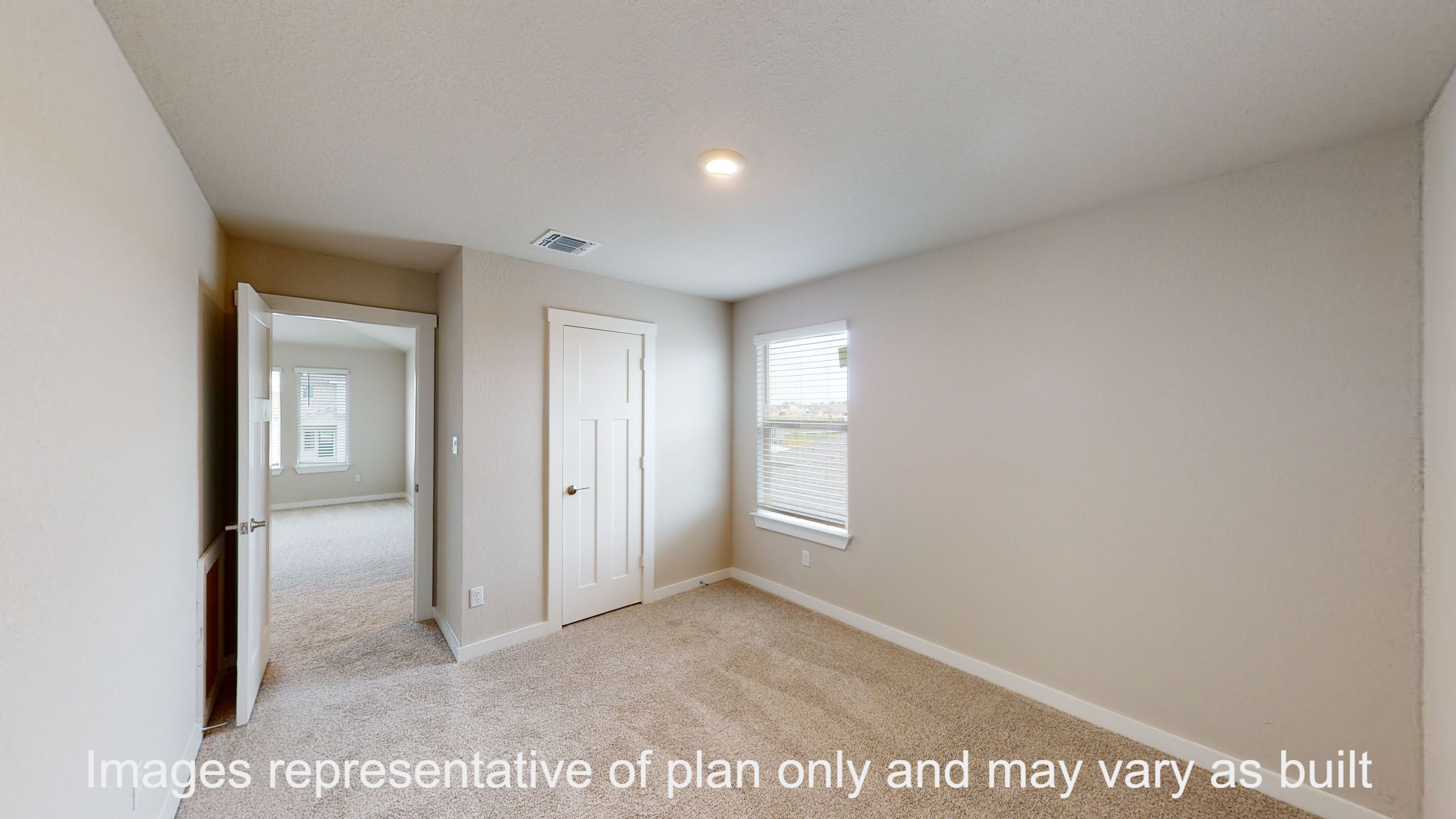 Florence primary bedroom with carpet flooring and window.