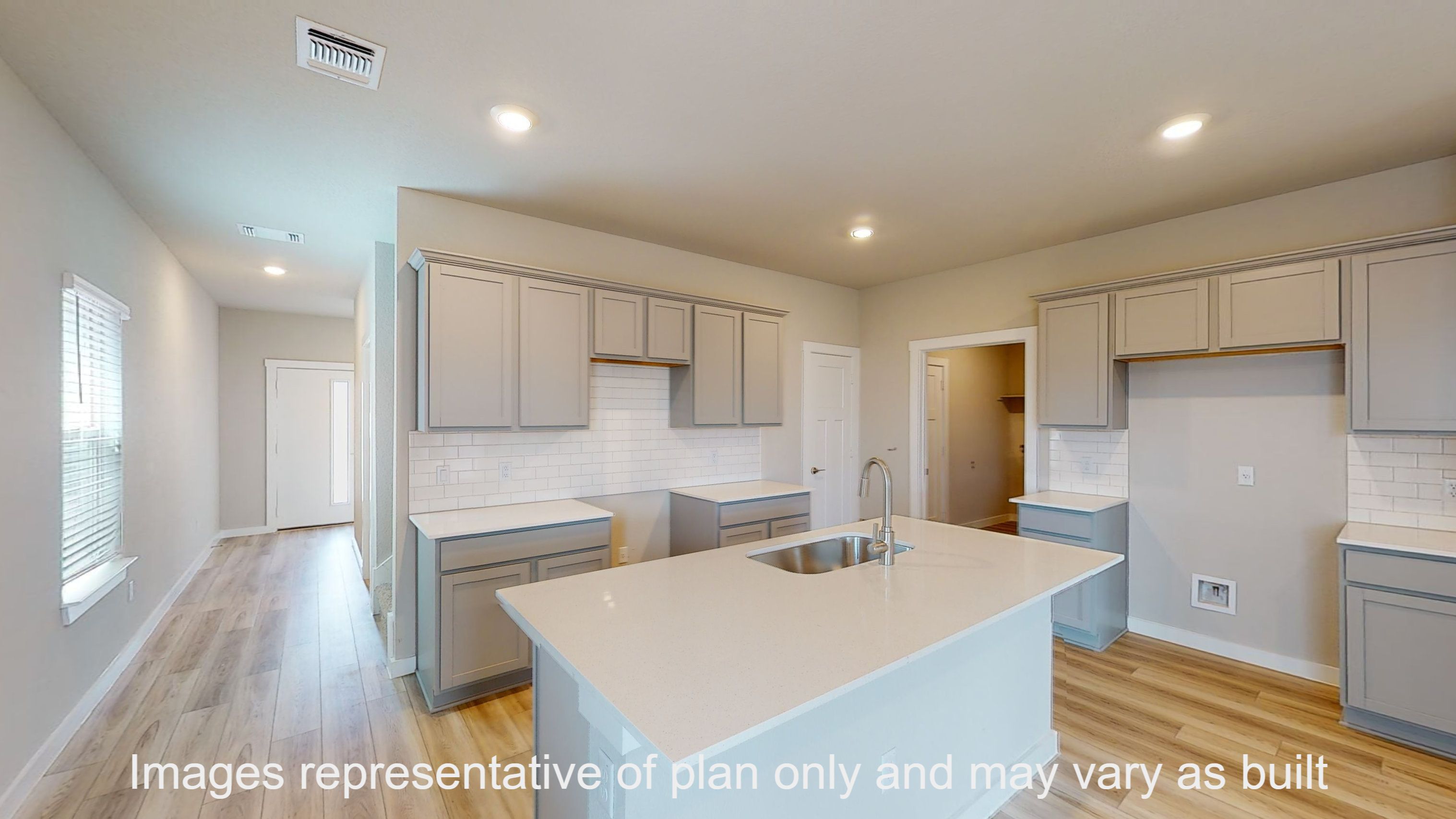 Florence kitchen with granite countertop and light cabinets.