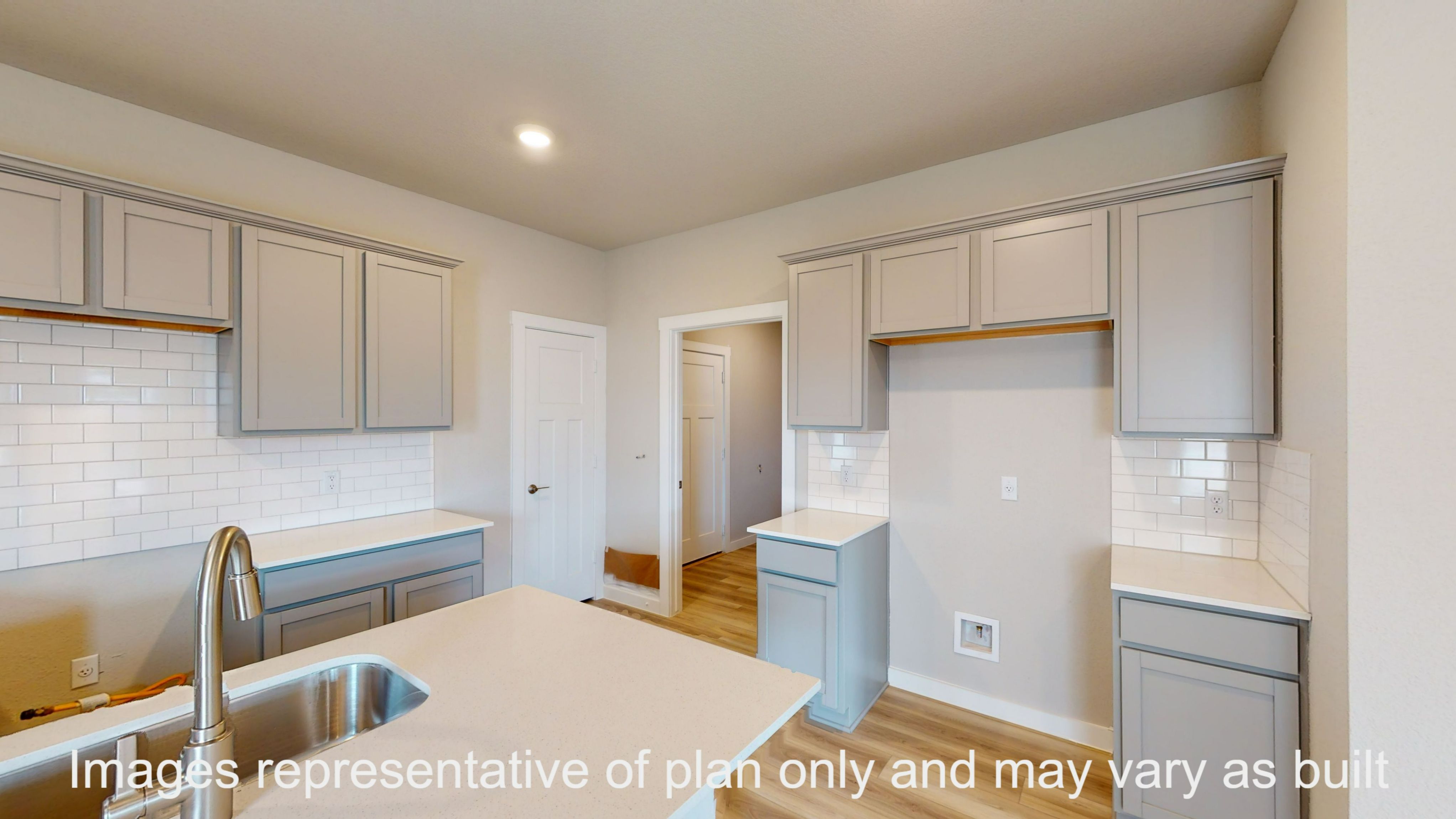 Florence kitchen with granite countertop and light cabinets.