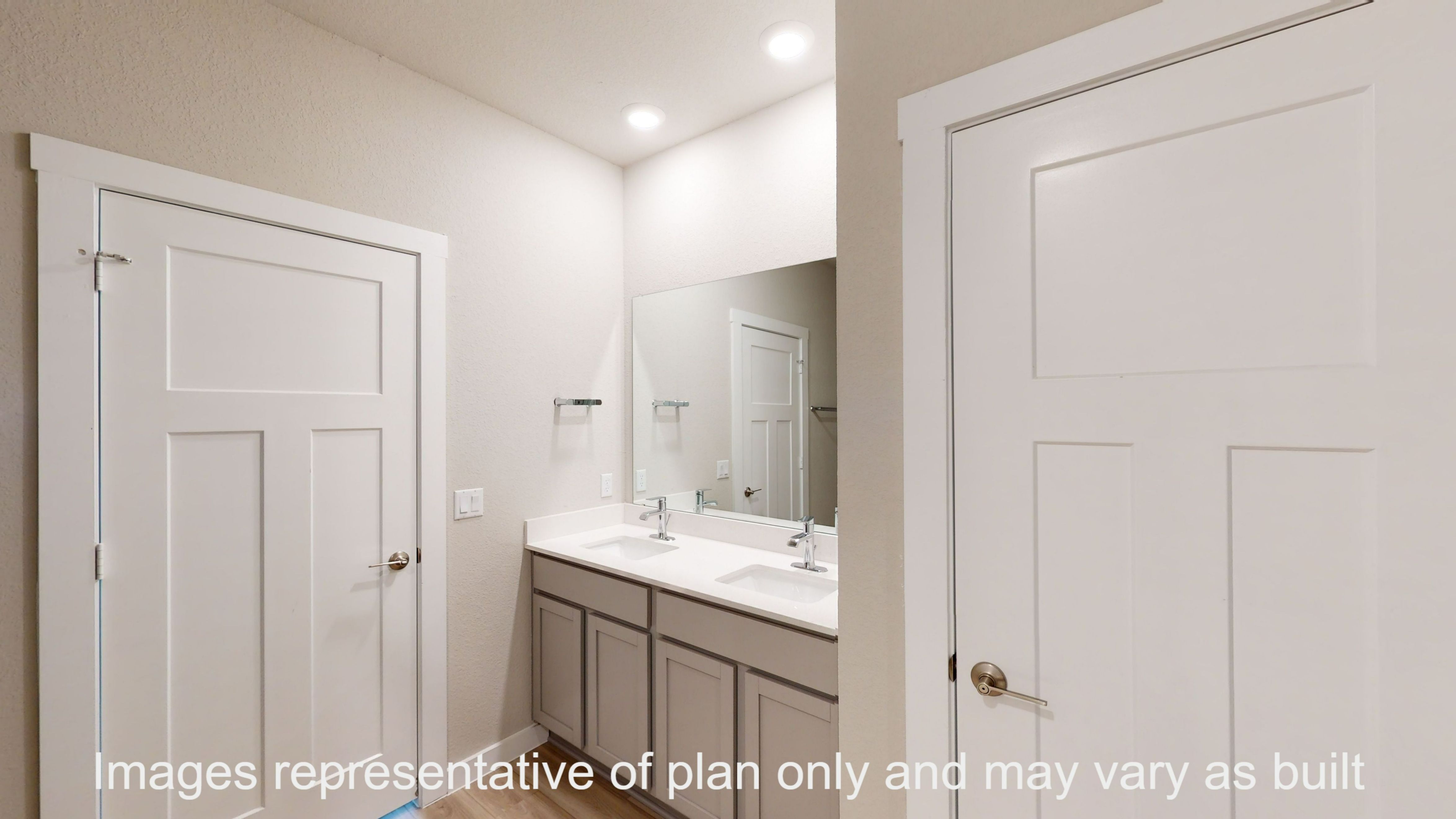 Florence primary bathroom with double vanity sink and mirror.