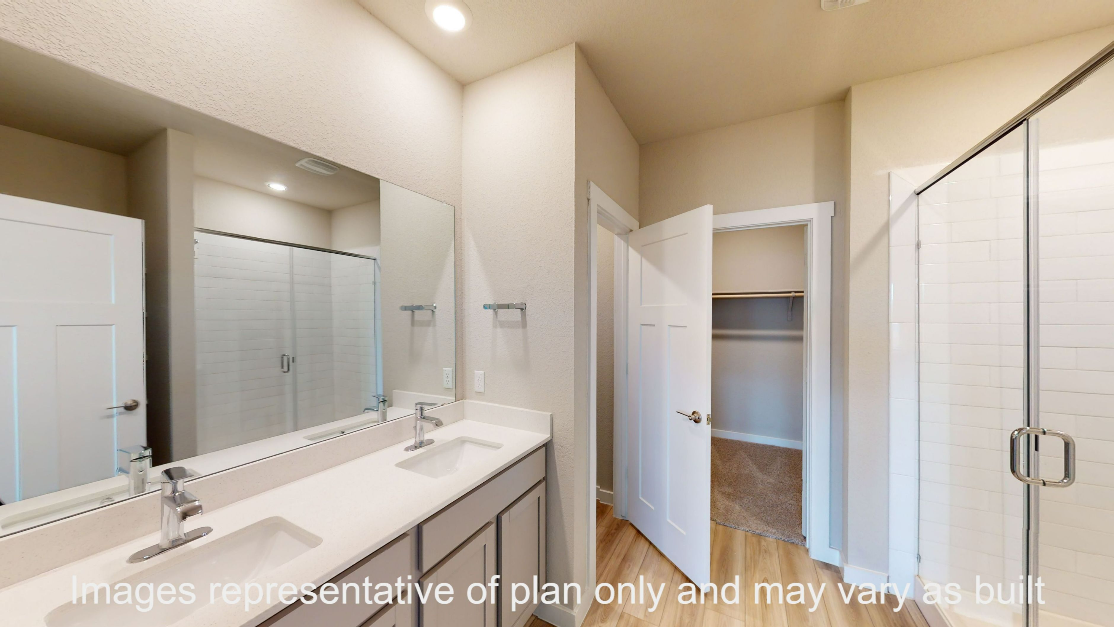Florence primary bathroom with double vanity sink and walk-in shower.