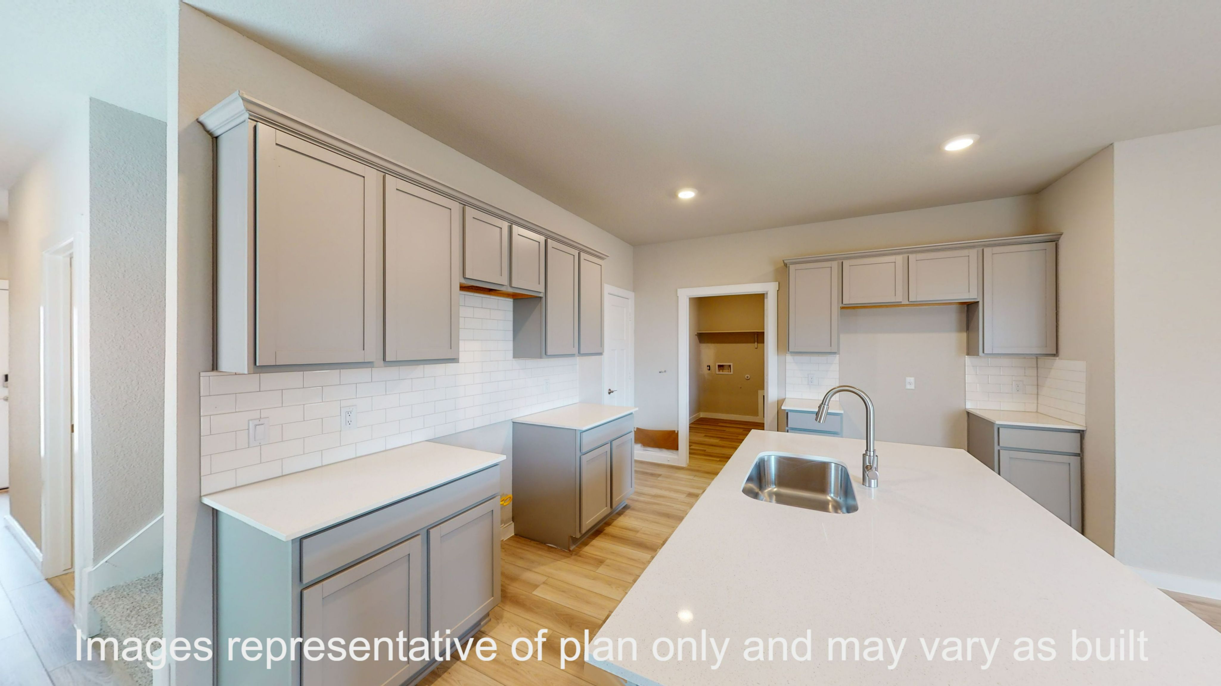 Florence kitchen with granite countertop and light cabinets.