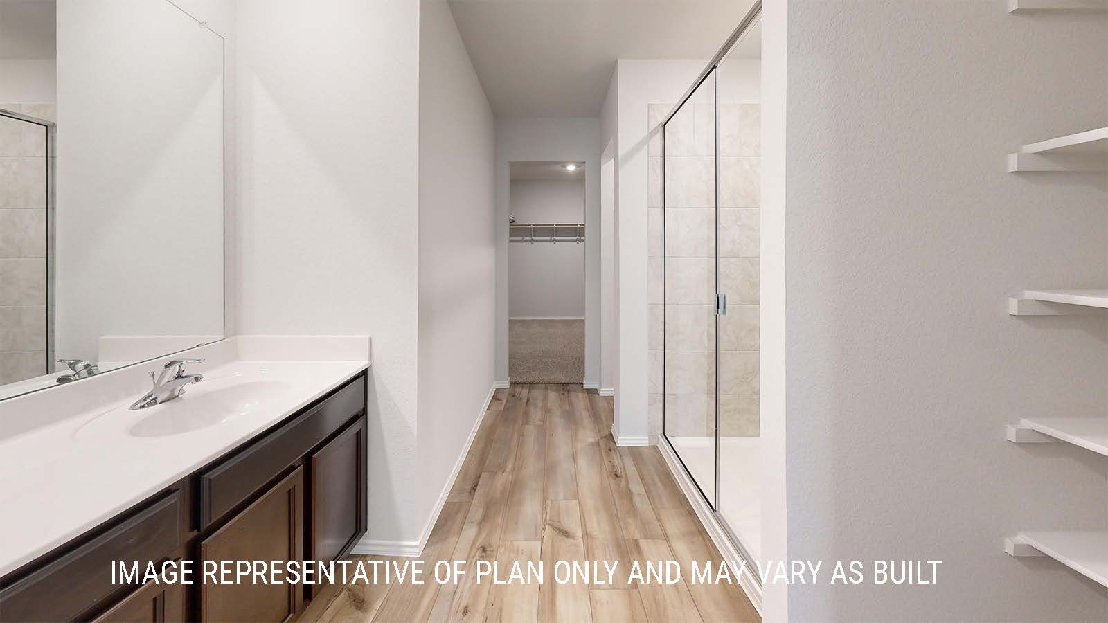 Grace primary bathroom with walk-in shower and view of the primary closet.