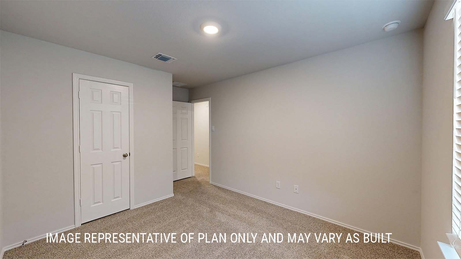 Grace secondary bedroom with carpeted flooring and window for lighting.