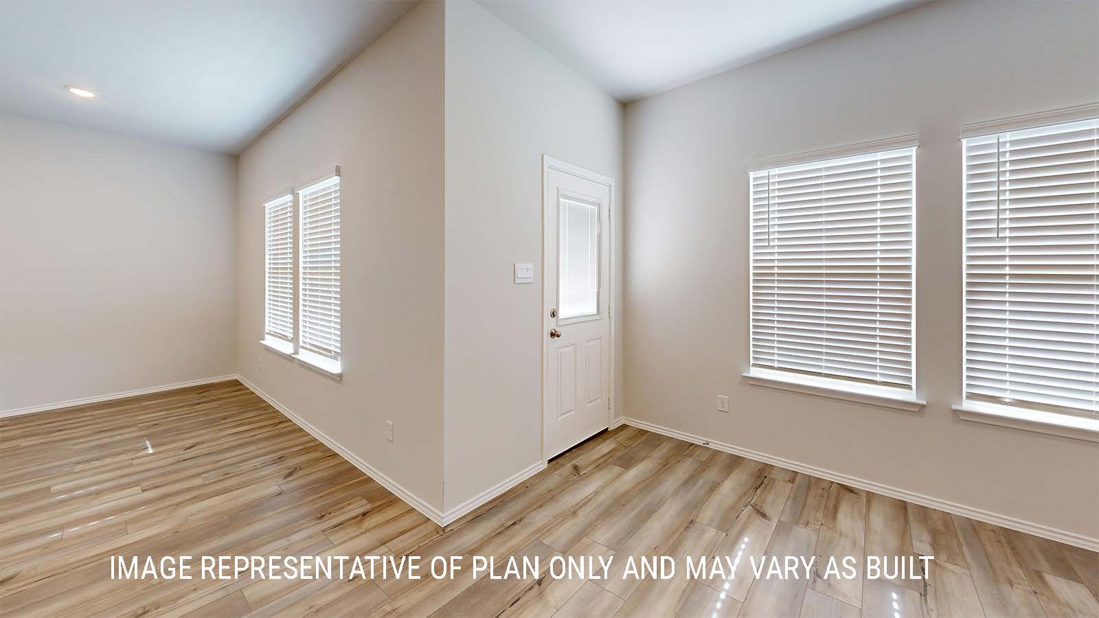 Grace dining room with view of living room and back door.