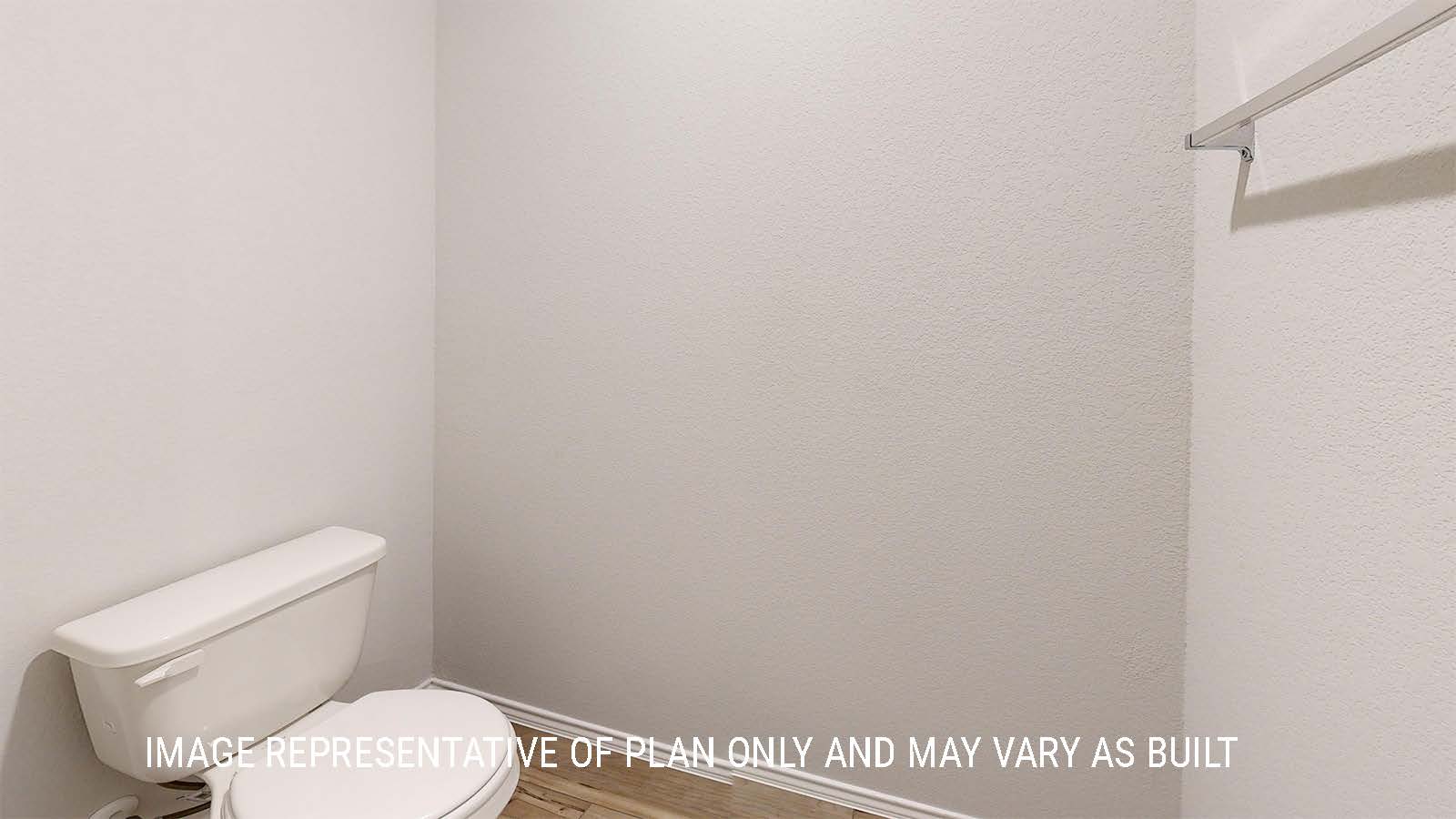 Grace utility room with washer and dryer connections and shelving for storage.